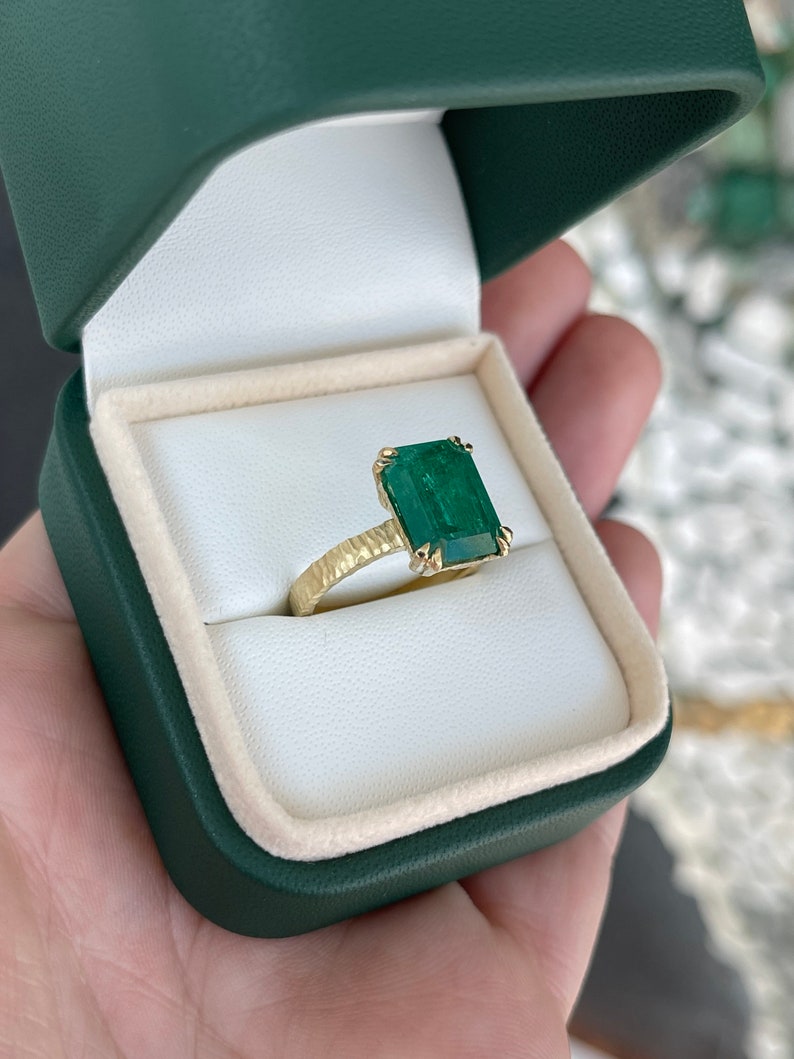 Colombian Emerald 4.45ct 18K matte hammered gold solitaire ring with dark green emerald-cut gemstone and rustic double claw setting