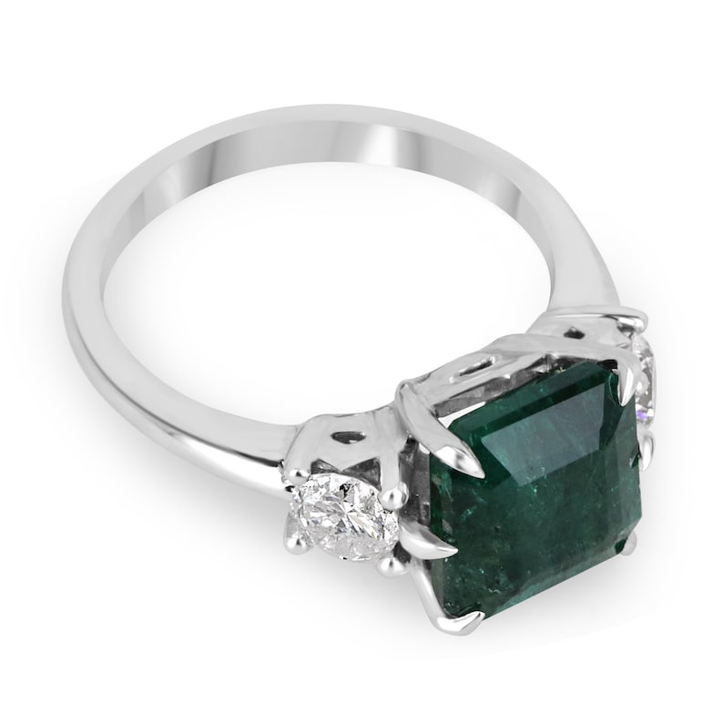 14K gold 3-stone engagement ring with intense dark green Asscher cut emerald and round diamonds, by Colombian Emerald.