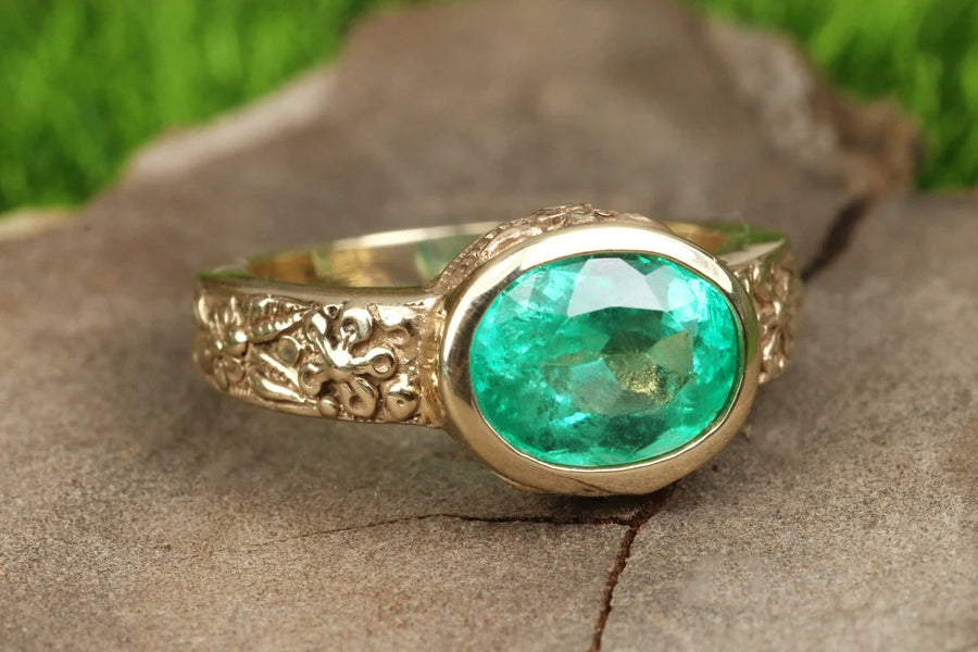 Floral Colombian emerald Oval 2.10 carat bezel ring