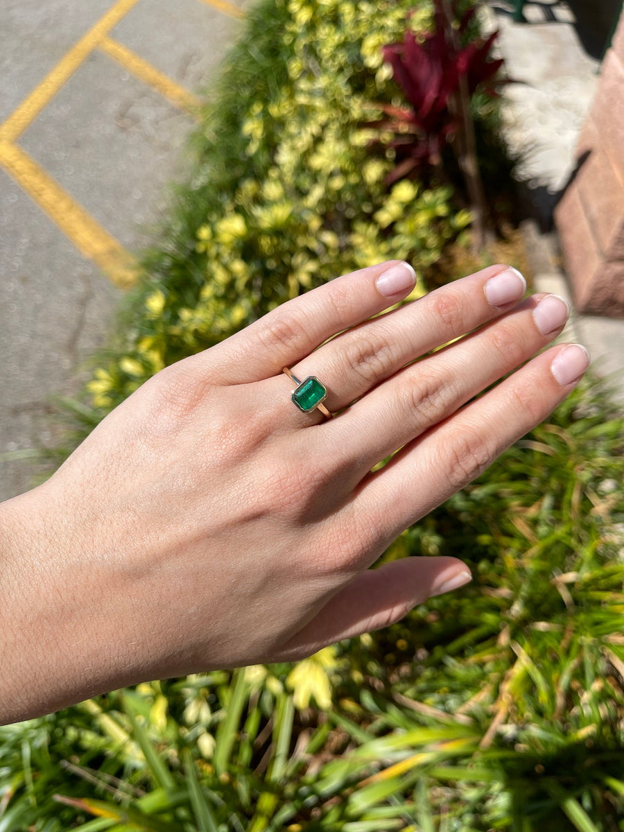 Radiant Beauty: 1.10 Carat Dark Green Emerald Cut Emerald in Bezel Set Stackable 14K Gold Ring