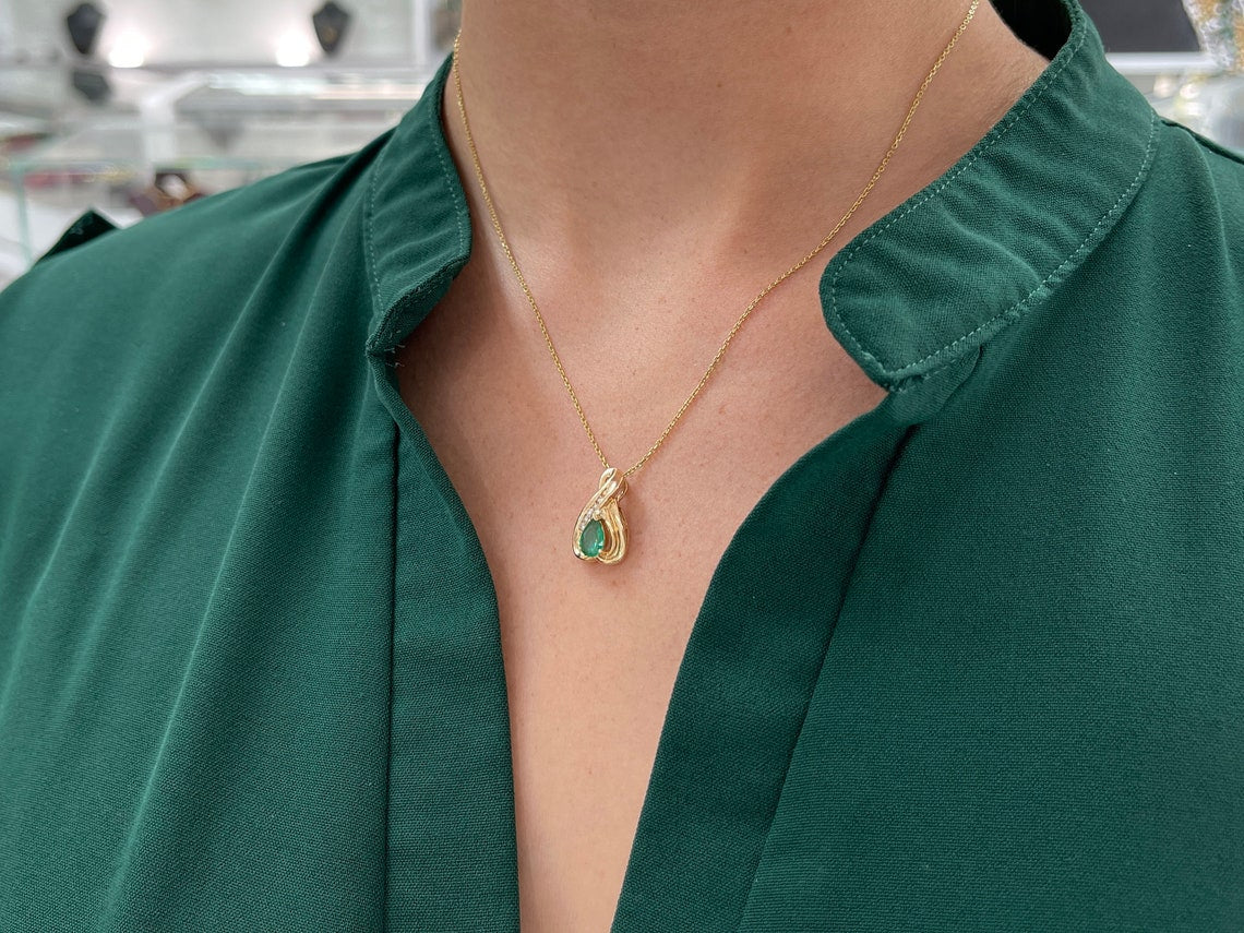 0.45tcw 14K Natural Emerald-Pear Cut Prong Set