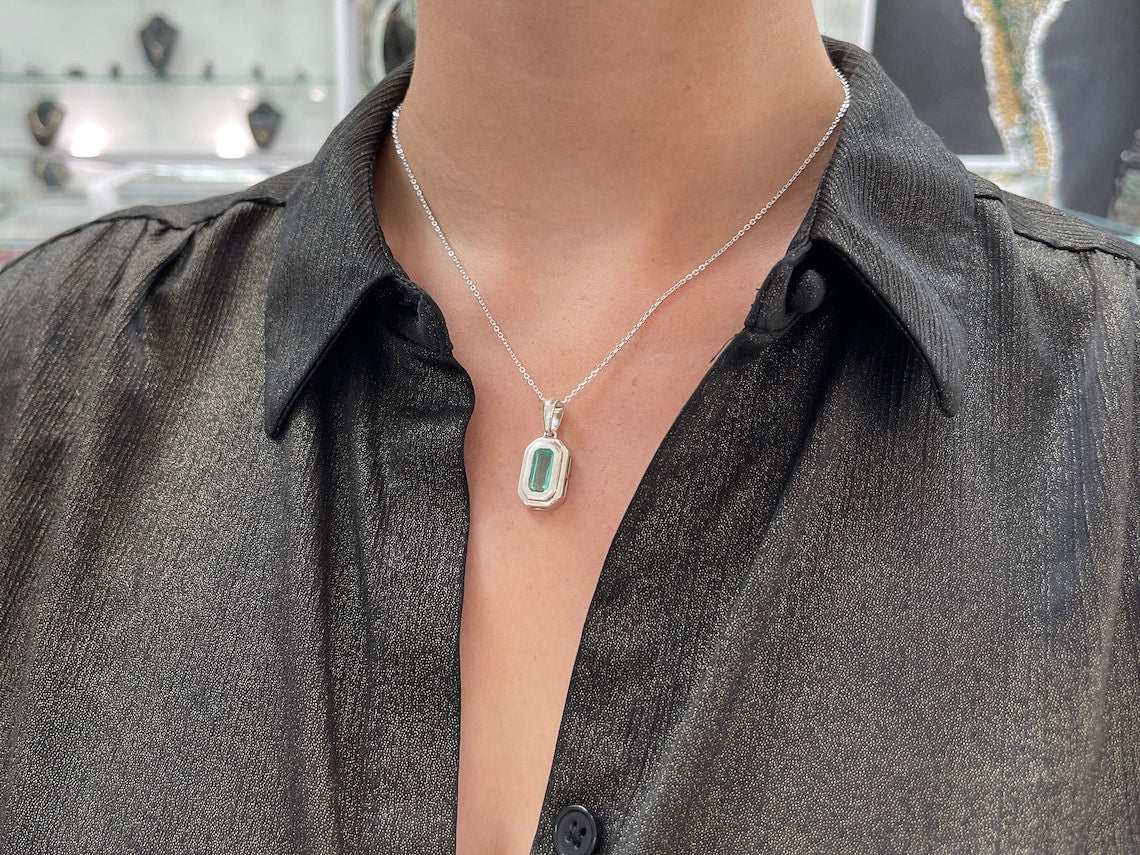 1.40ct Colombian Emerald Elongated Cut Solitaire Pendant on neck