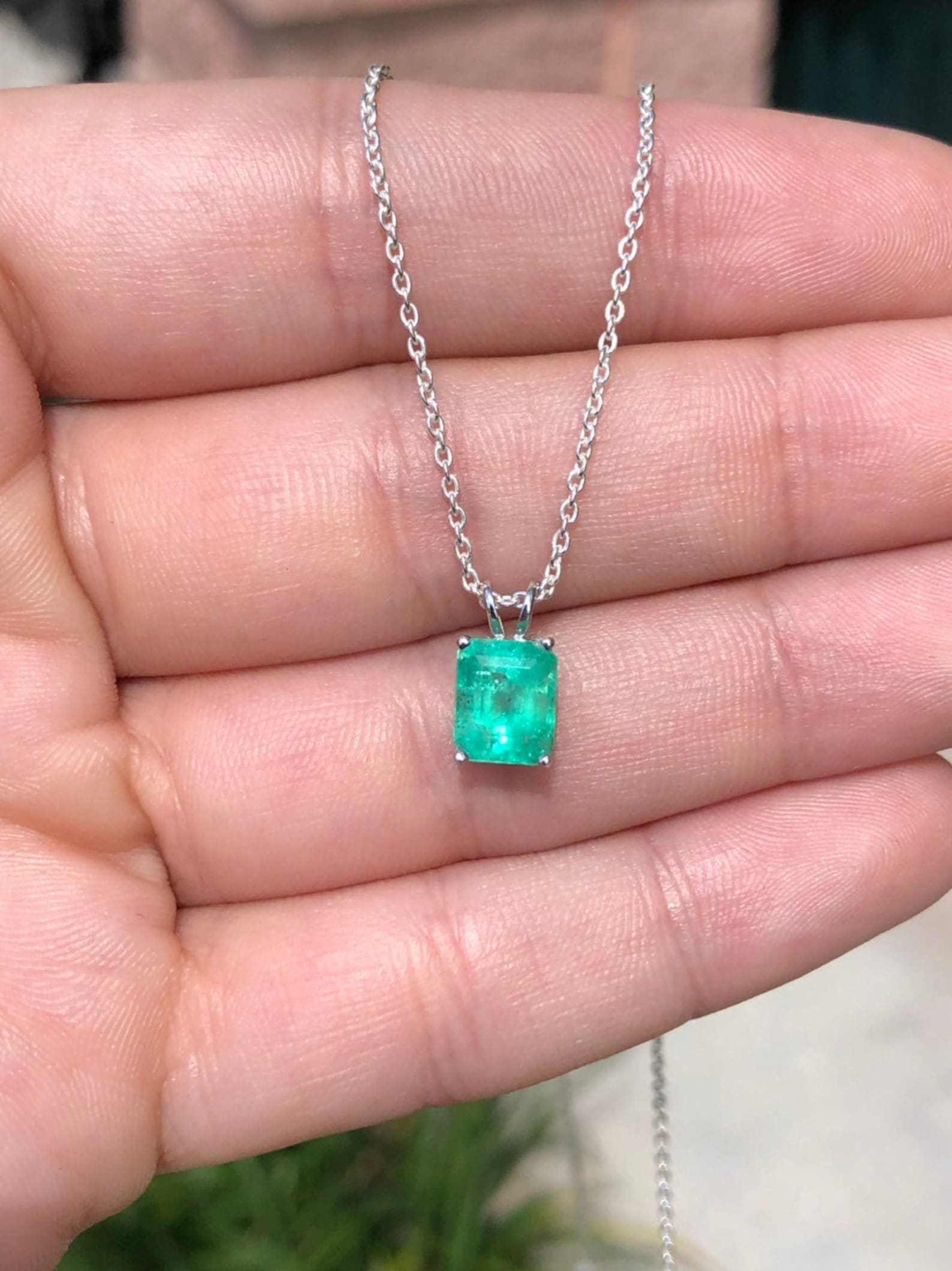 1.74ct emerald cut Zambian emerald pendant necklace in sterling silver solitaire setting