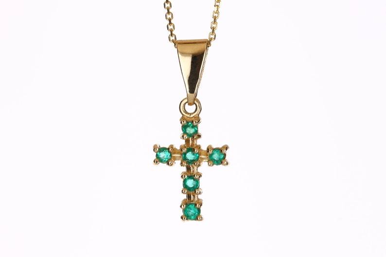0.30tcw Colombian emerald round cut cross pendant in 18k yellow gold with hand-carved details