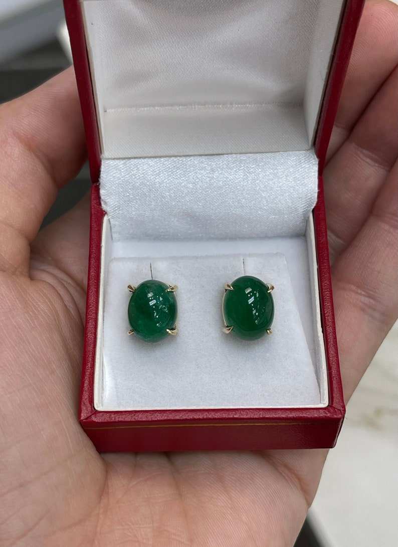 Dark forest green emerald cabochon oval cut earrings in 14K gold by Colombian Emerald, showcasing elegant gemstone jewelry.