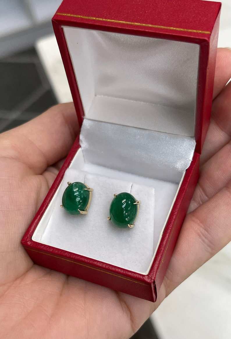 Dark forest green emerald cabochon oval cut earrings in 14K gold by Colombian Emerald, showcasing elegant gemstone dangle jewelry.