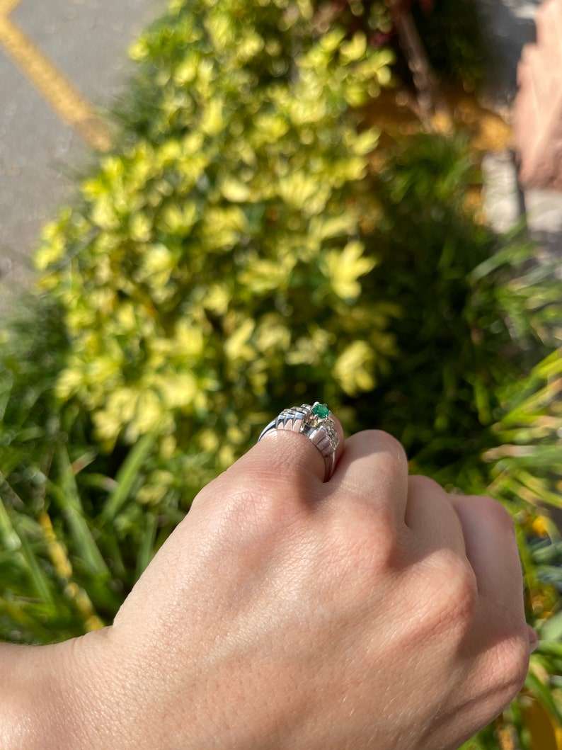 Colombian Emerald marquise diamond cocktail ring with platinum band, semi-transparent design and 0.88 carats of vibrant green gemstones.