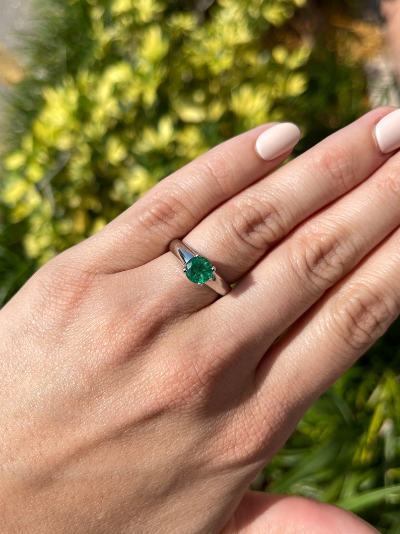 Celebrate Brilliance: 14K Gold Ring Featuring 1.32tcw Natural Emerald & Diamond Accent