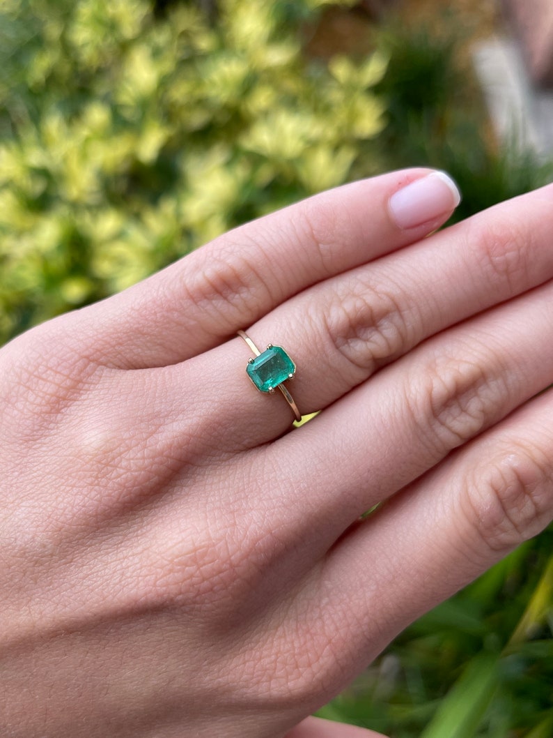 Chic and Sophisticated: 14K Yellow Gold Ring with 1.20cts Emerald Cut Solitaire