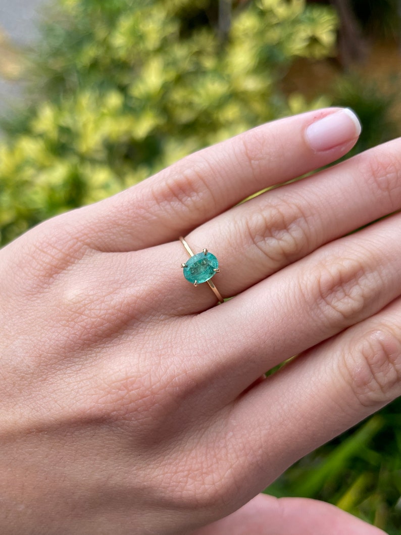 Charm and Grace: 14K Gold Ring with 1.30cts Dainty Emerald Oval Cut Solitaire - A Thoughtful Gift