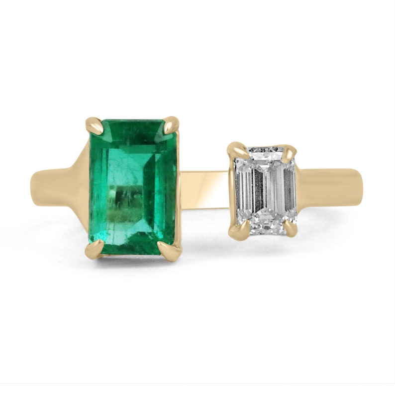 18K yellow gold Toi Et Moi engagement ring with 1.54ct emerald and 0.52ct diamond emerald cut stones