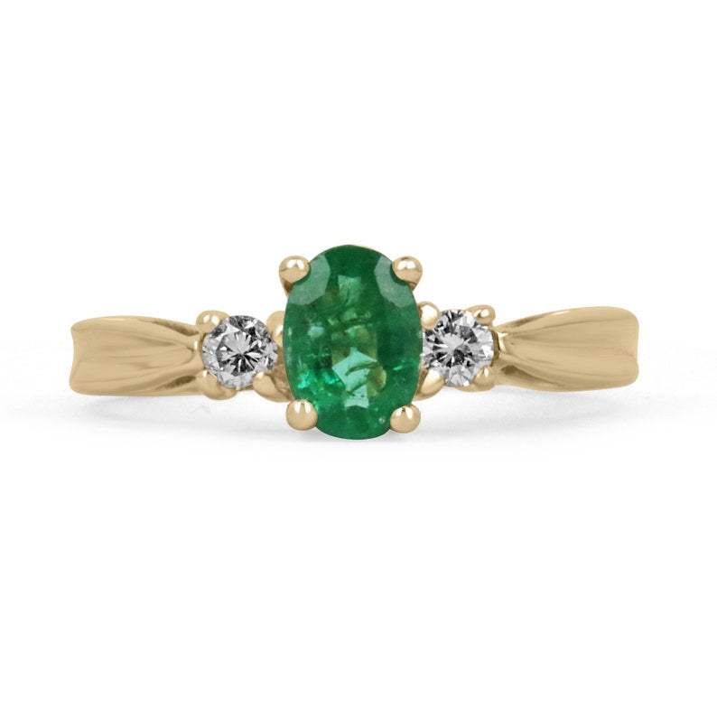 14K gold ring with natural medium dark vivid green oval emerald and two round diamonds