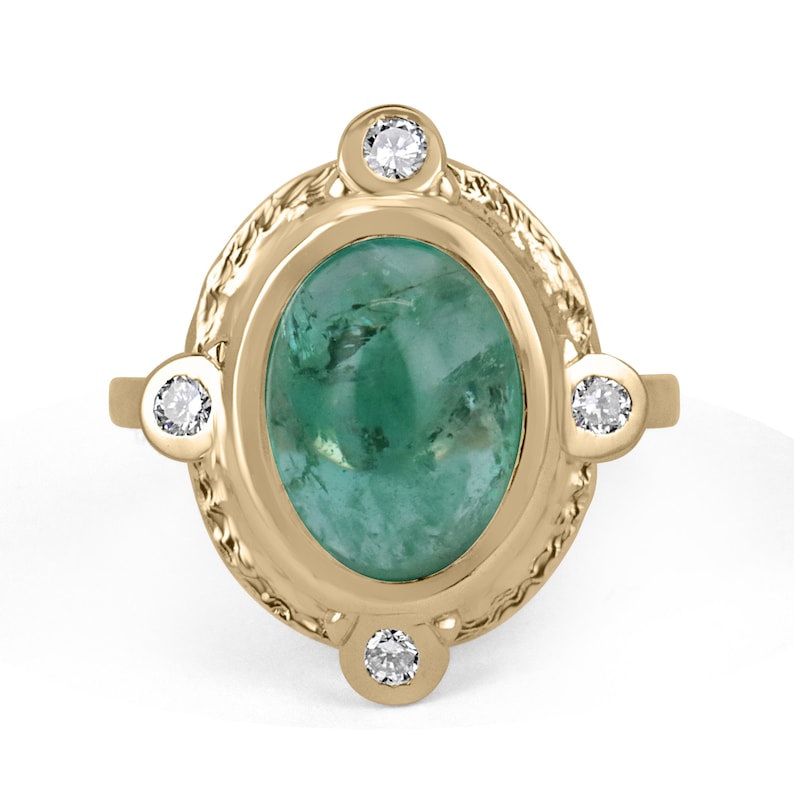 Vintage styled emerald oval cabochon cut ring with diamond accents in 14K yellow gold