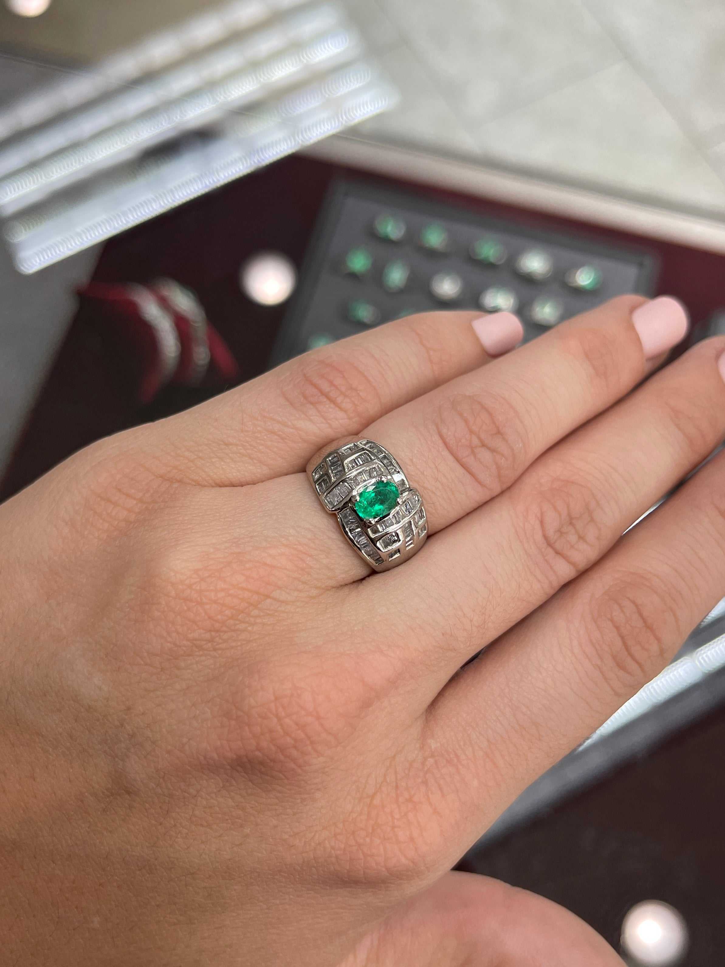 18K Colombian Emerald and diamond baguette cocktail ring with oval cut emerald, crafted by JR Colombian Emeralds.