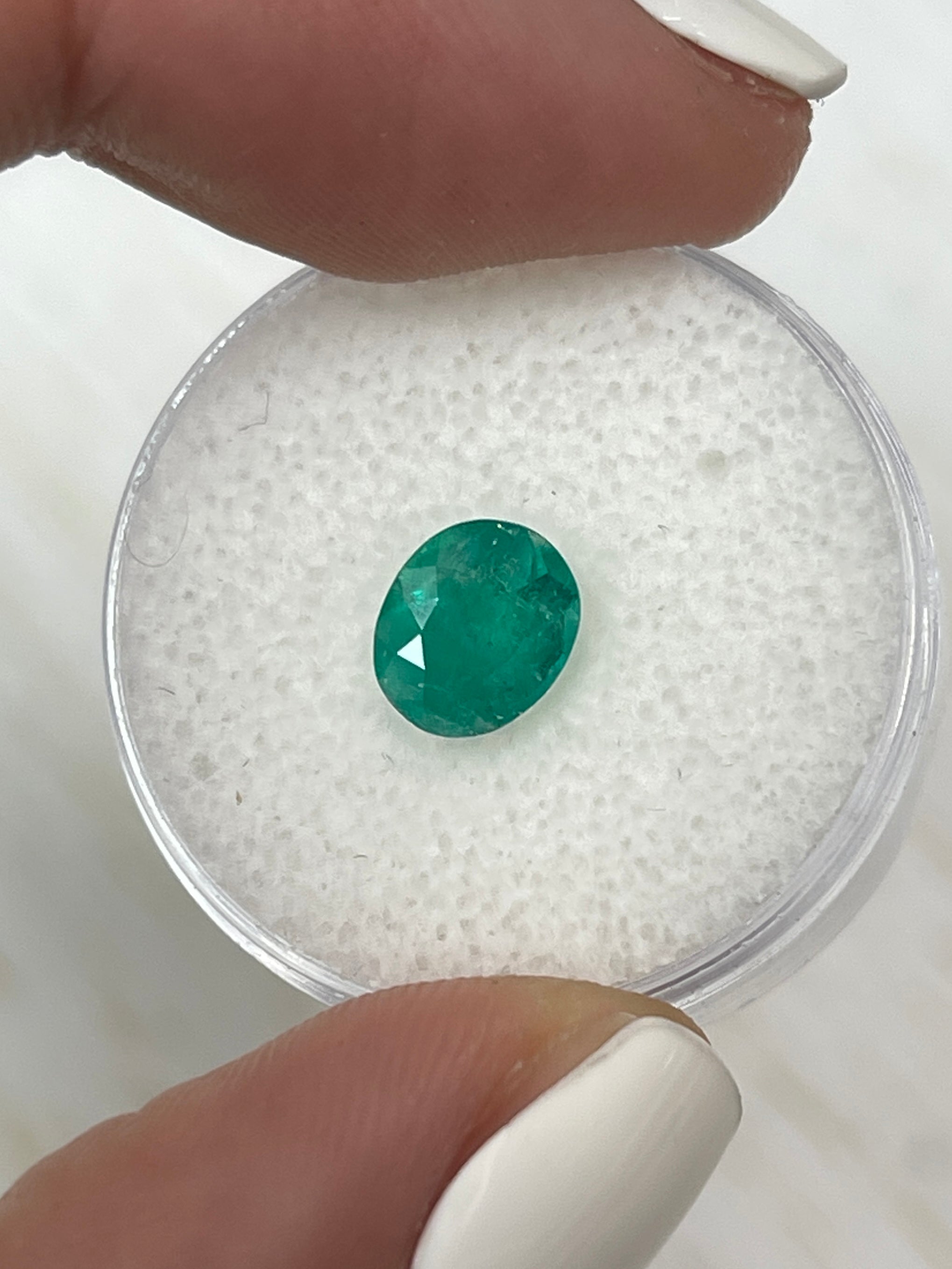Oval cut 1.19 carat semi-transparent rich green natural Colombian emerald loose gemstone by JR Colombian Emeralds.