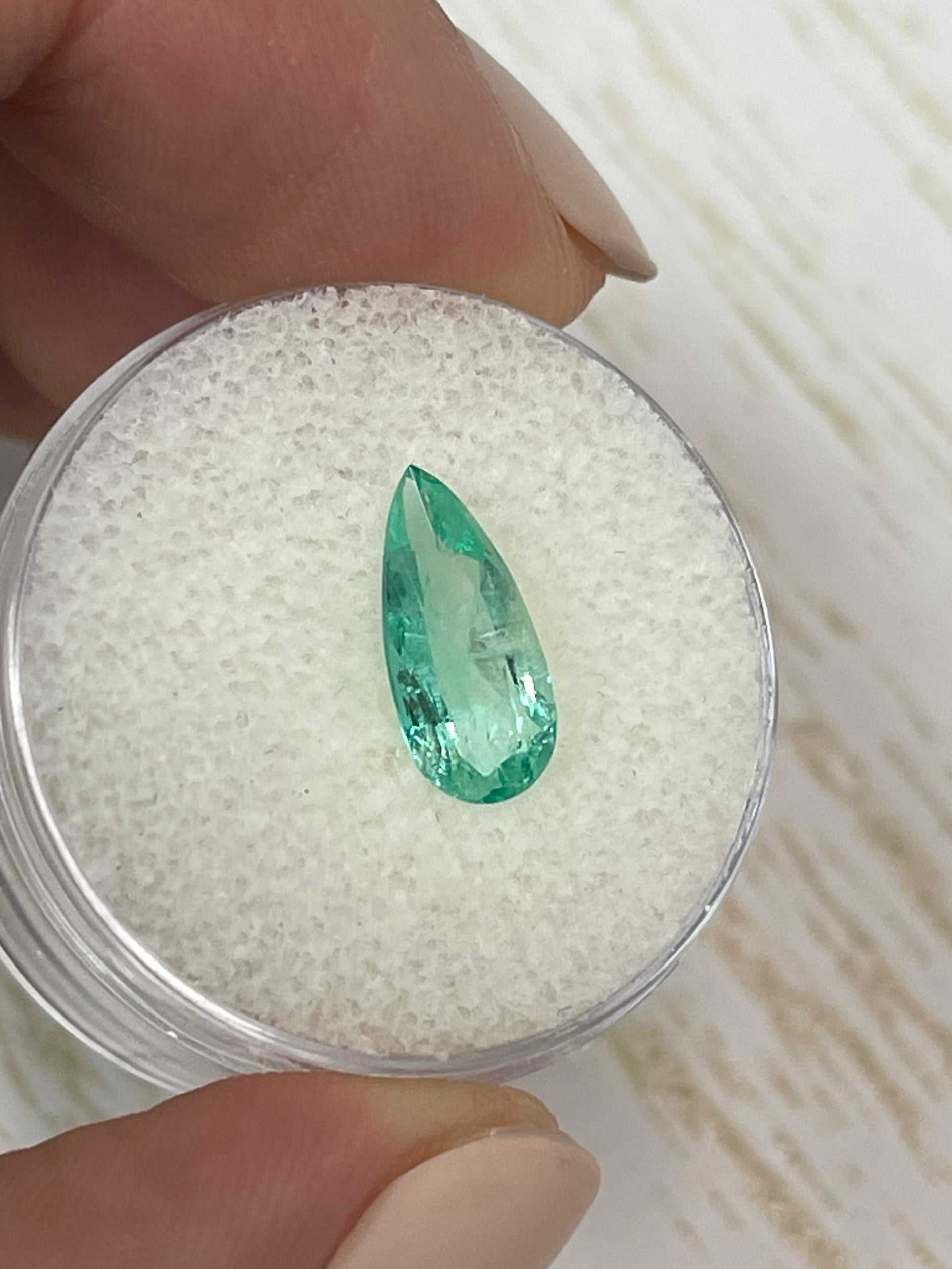 1.49 carat slender green natural Colombian emerald loose pear cut gemstone from JR Colombian Emeralds.