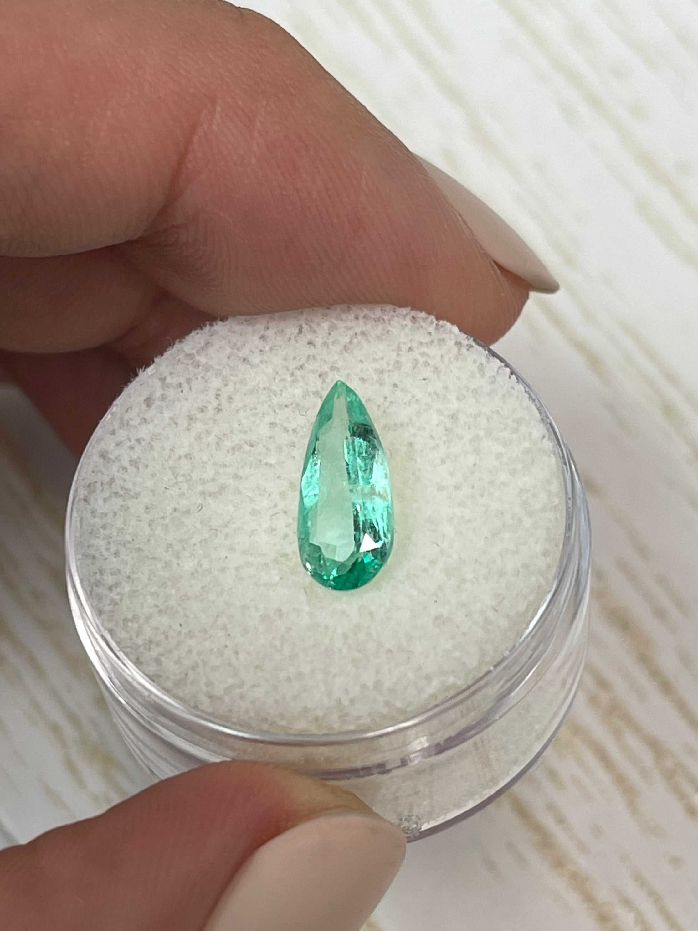 1.49 carat slender green natural Colombian emerald in a pear cut, loose gemstone from JR Colombian Emeralds.