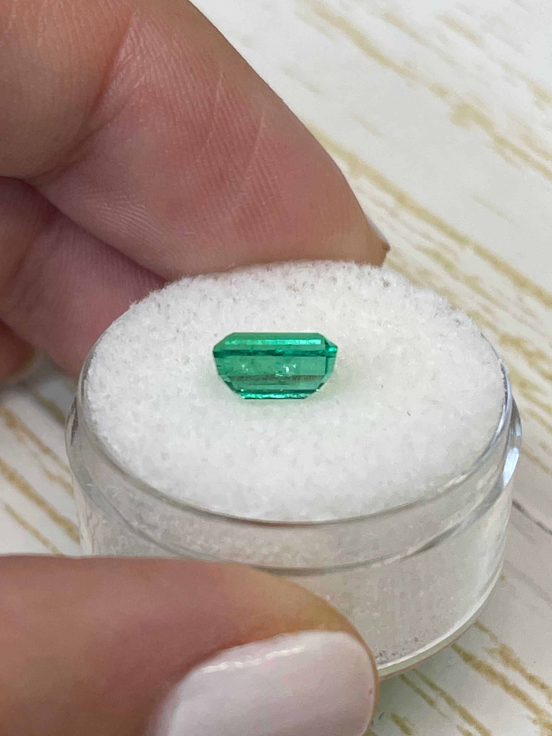 Natural 1.50 carat elongated 8x5 Muzo green Colombian emerald loose gemstone with emerald cut by JR Colombian Emeralds.