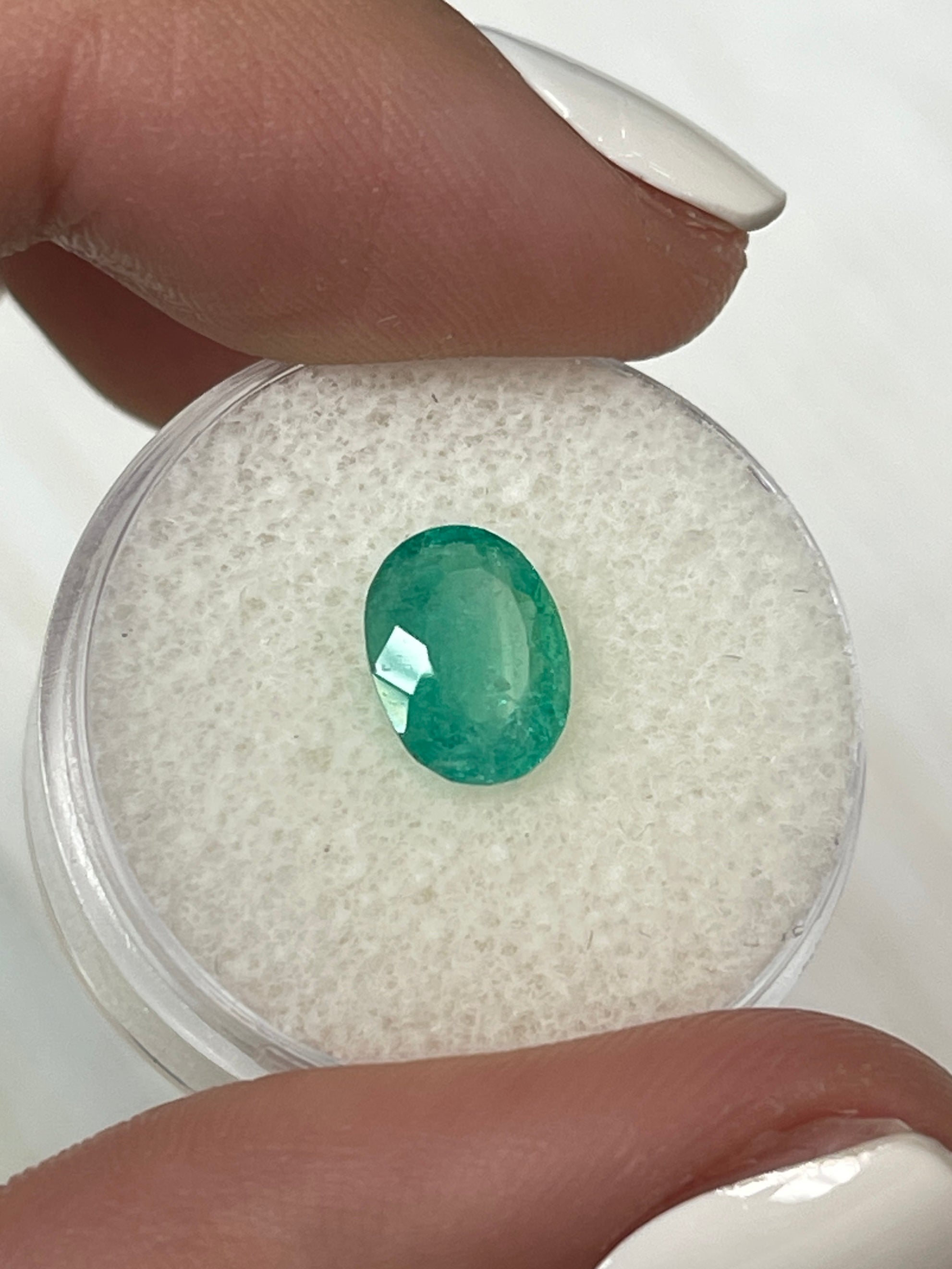 Loose 1.63 Carat Colombian Emerald in oval cut, bluish green, natural and cloudy, from JR Colombian Emeralds.