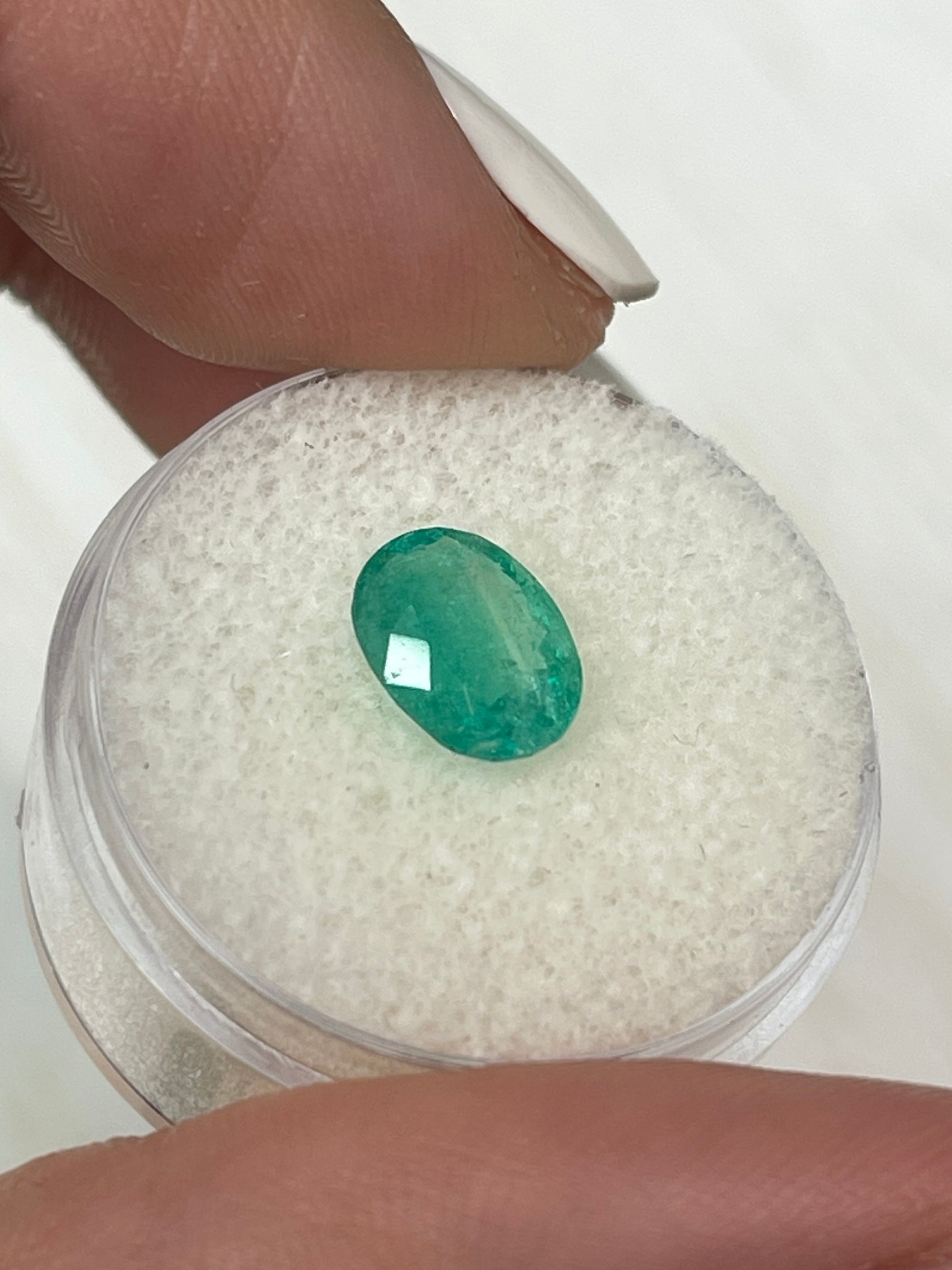 9.3x7.2 mm cloudy bluish green natural Colombian emerald loose oval cut, 1.63 carats, from JR Colombian Emeralds.