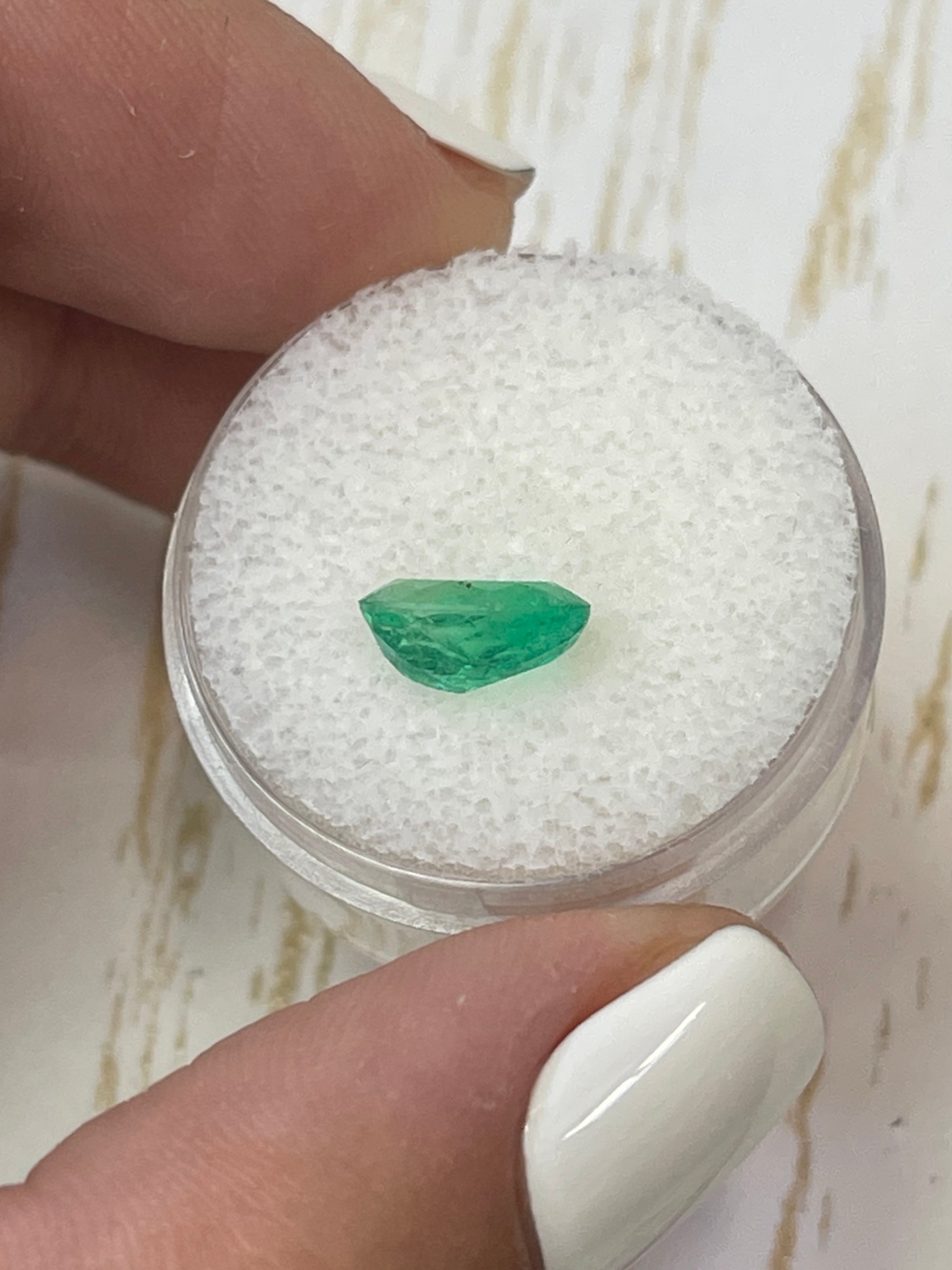 Oval cut 1.69 carat medium yellowish green natural Colombian emerald gemstone from JR Colombian Emeralds.