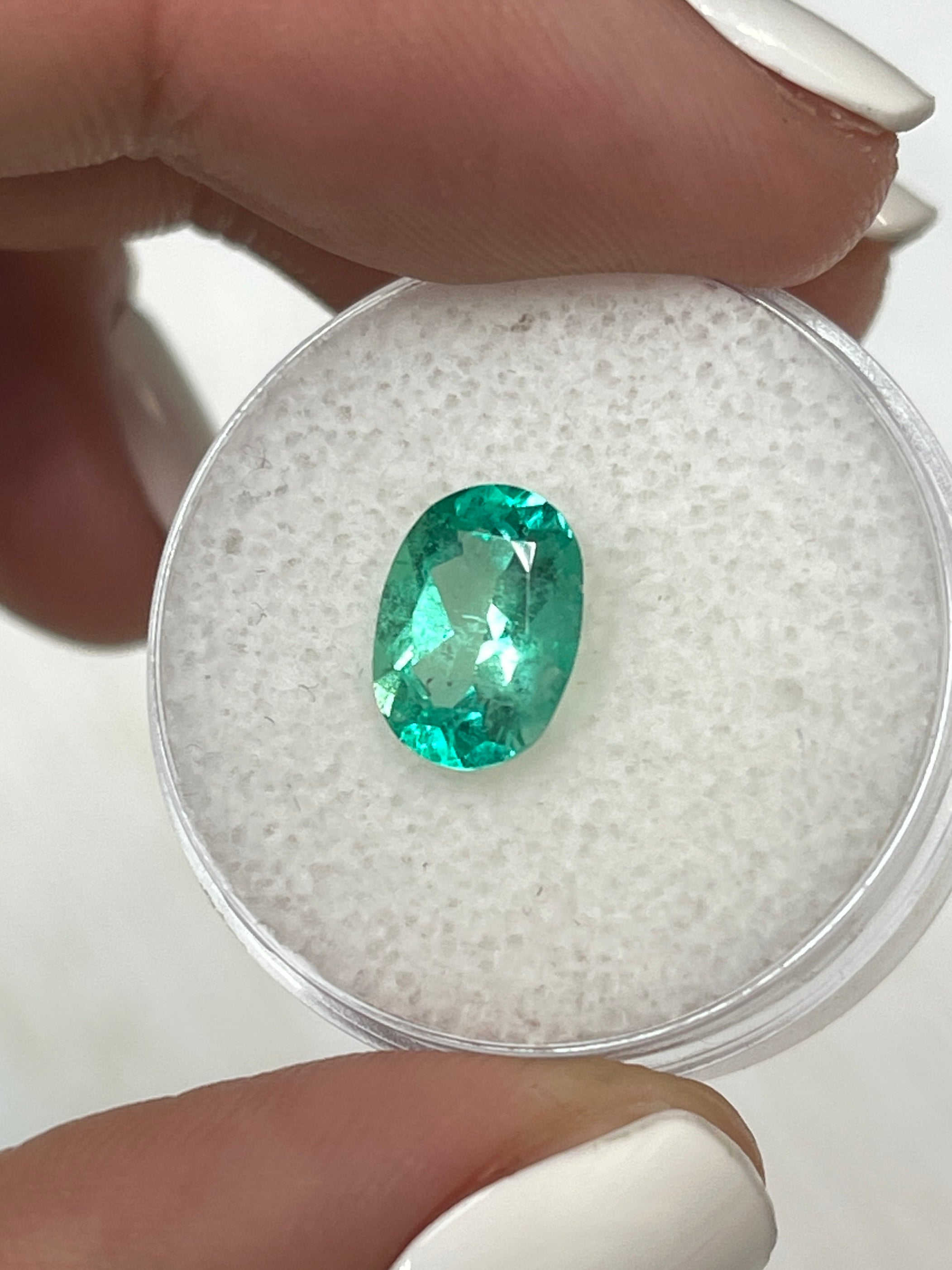 1.77 carat medium-light green Colombian emerald loose oval cut gemstone from JR Colombian Emeralds.