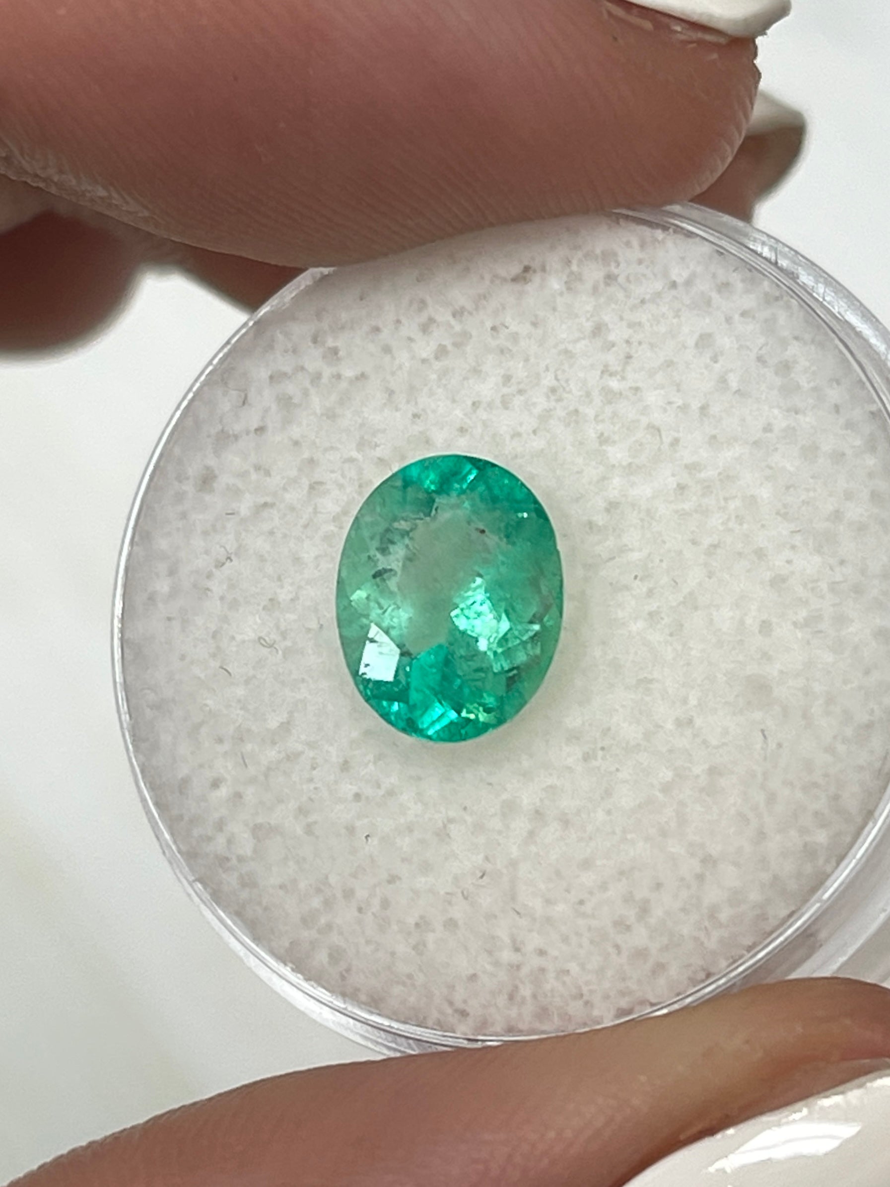 1.77 carat medium light green natural Colombian emerald loose oval cut gemstone from JR Colombian Emeralds