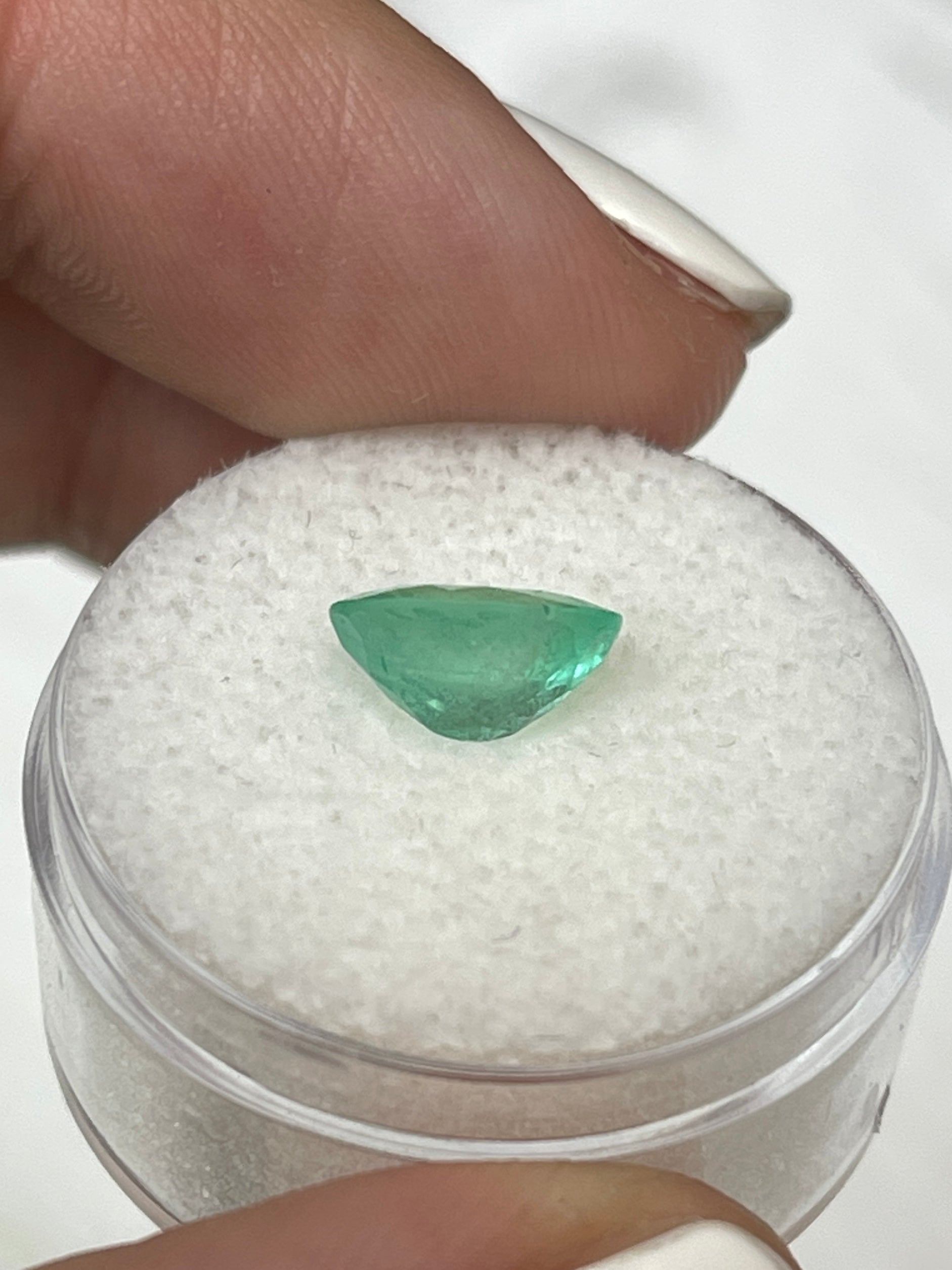 1.77 carat medium light green natural Colombian emerald loose oval cut gemstone, vibrant and sparkling, from JR Colombian Emeralds.