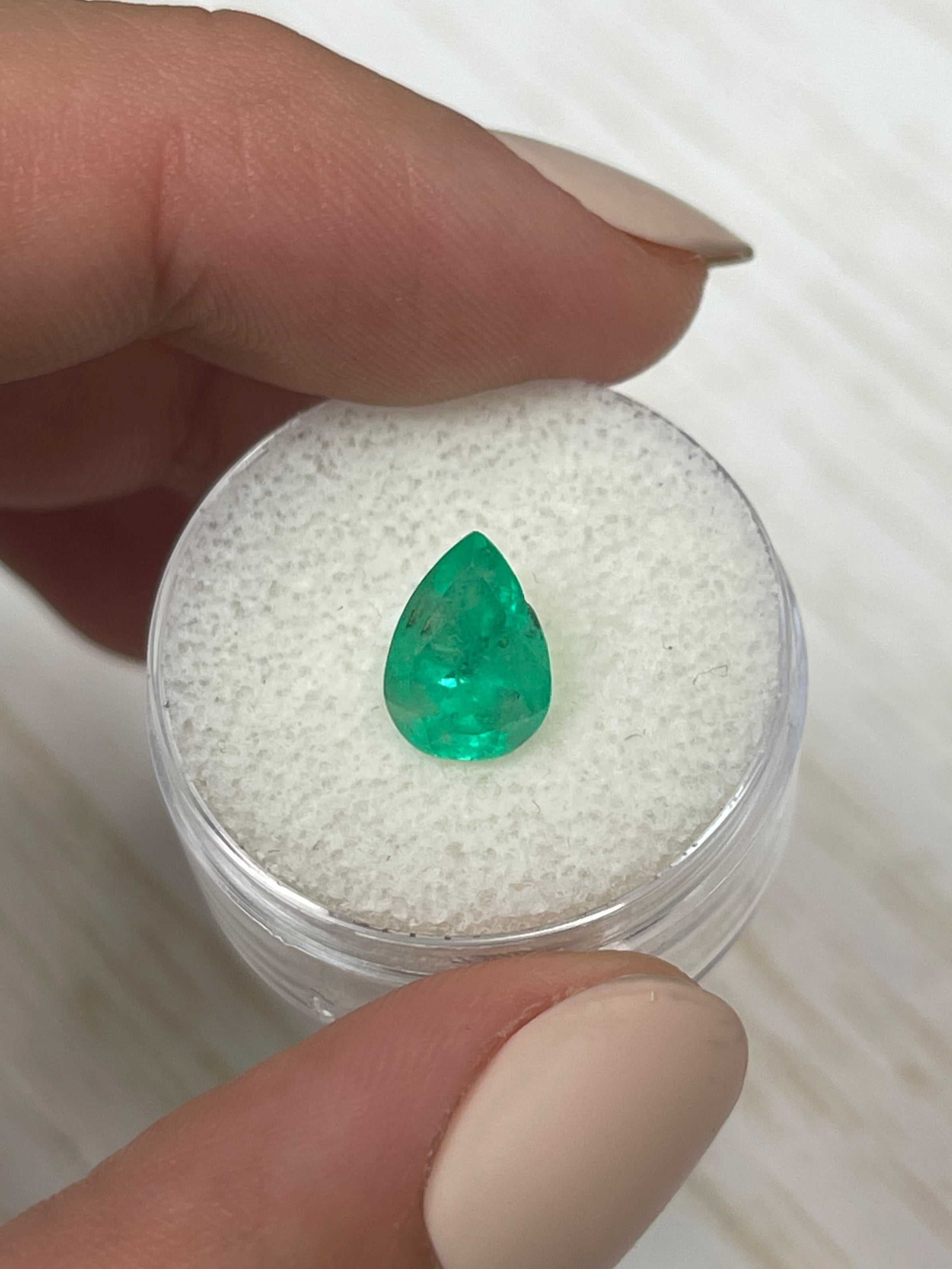 1.81 Carat spring green Colombian emerald loose gemstone with pear cut, natural and vibrant, from JR Colombian Emeralds.