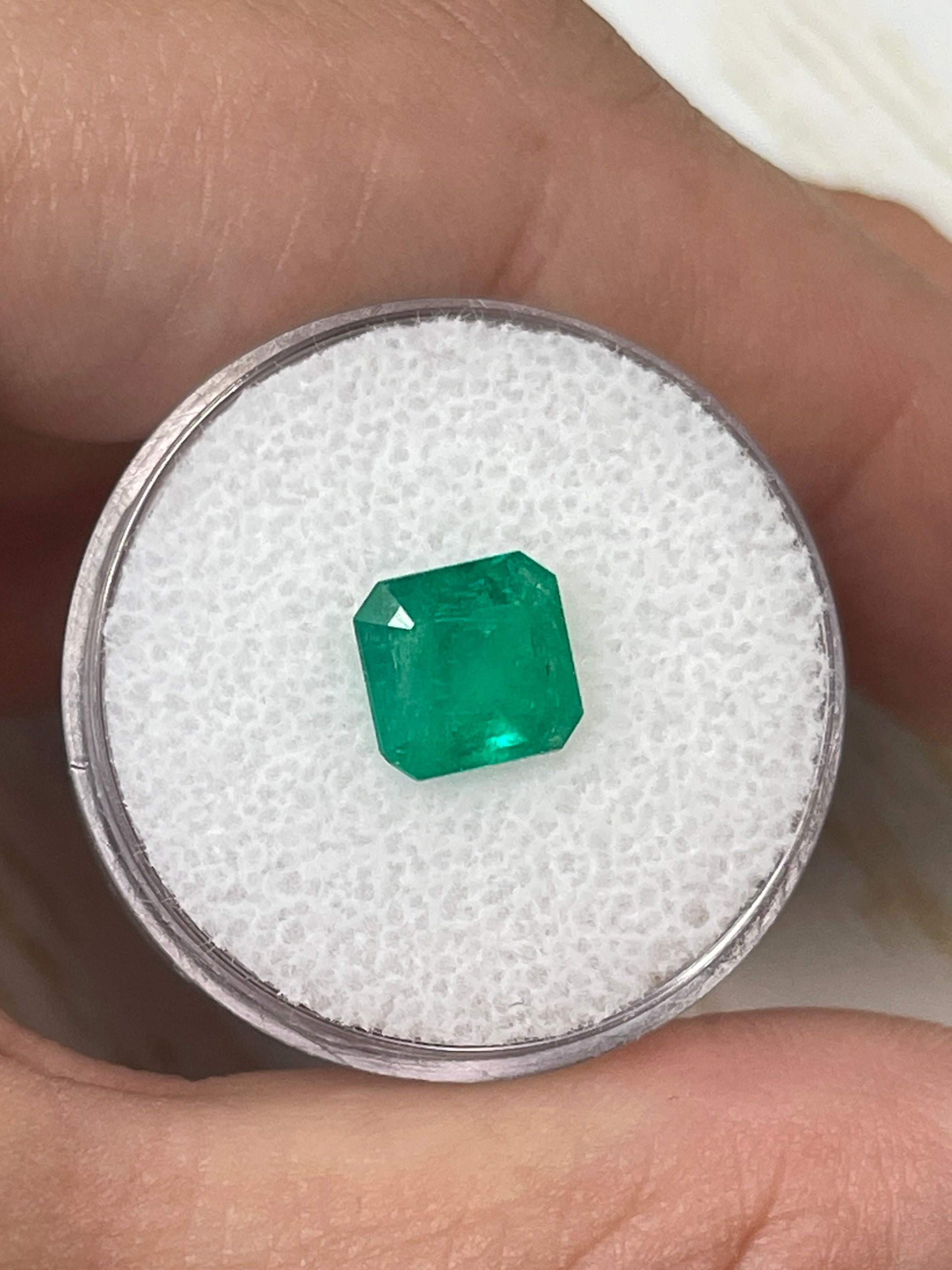 8x8mm natural Colombian emerald loose stone with Asscher cut, showcasing vibrant green color and clarity, by JR Colombian Emeralds.