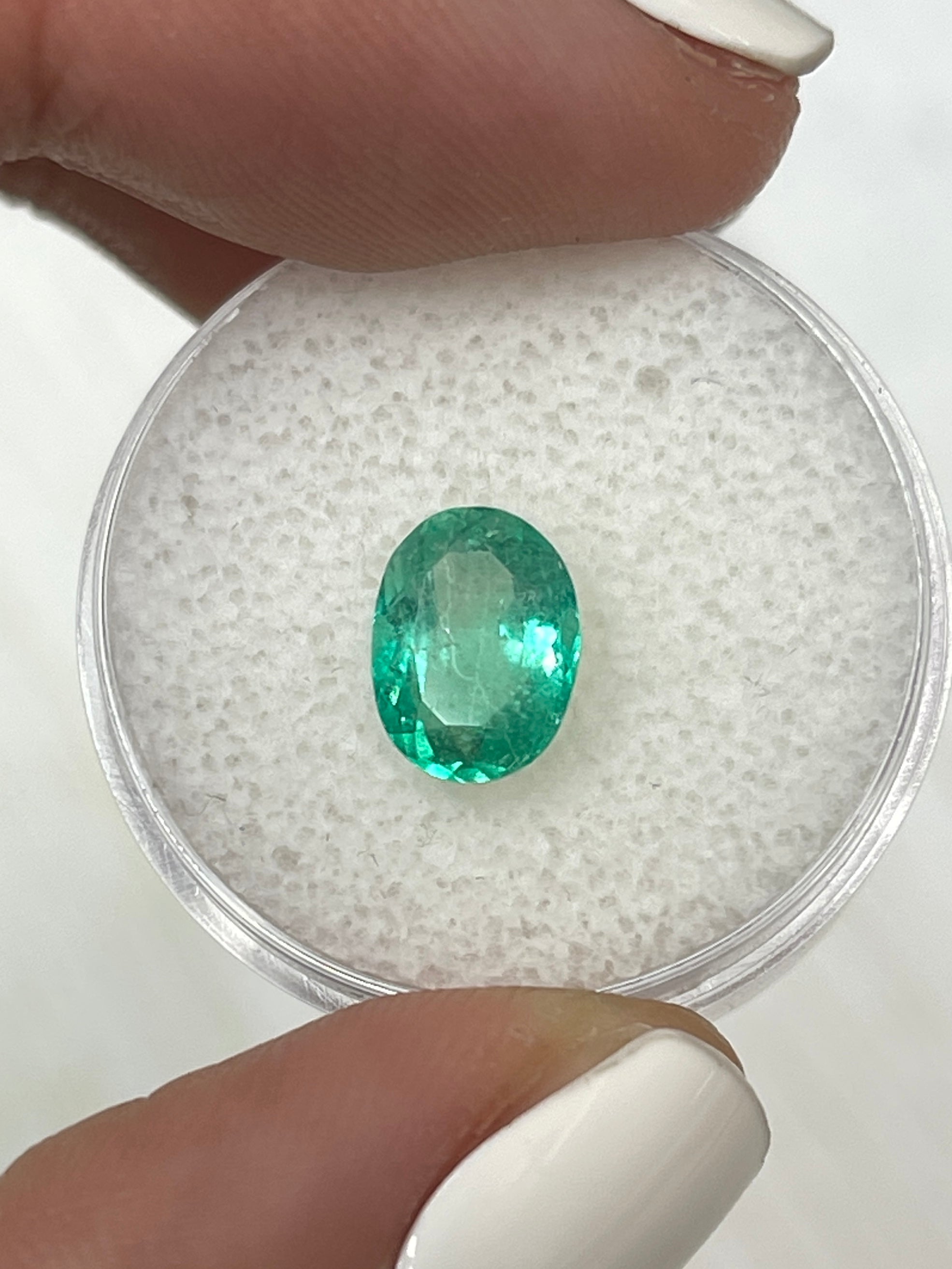 1.86 carat medium light green natural Colombian emerald loose oval cut gemstone from JR Colombian Emeralds.