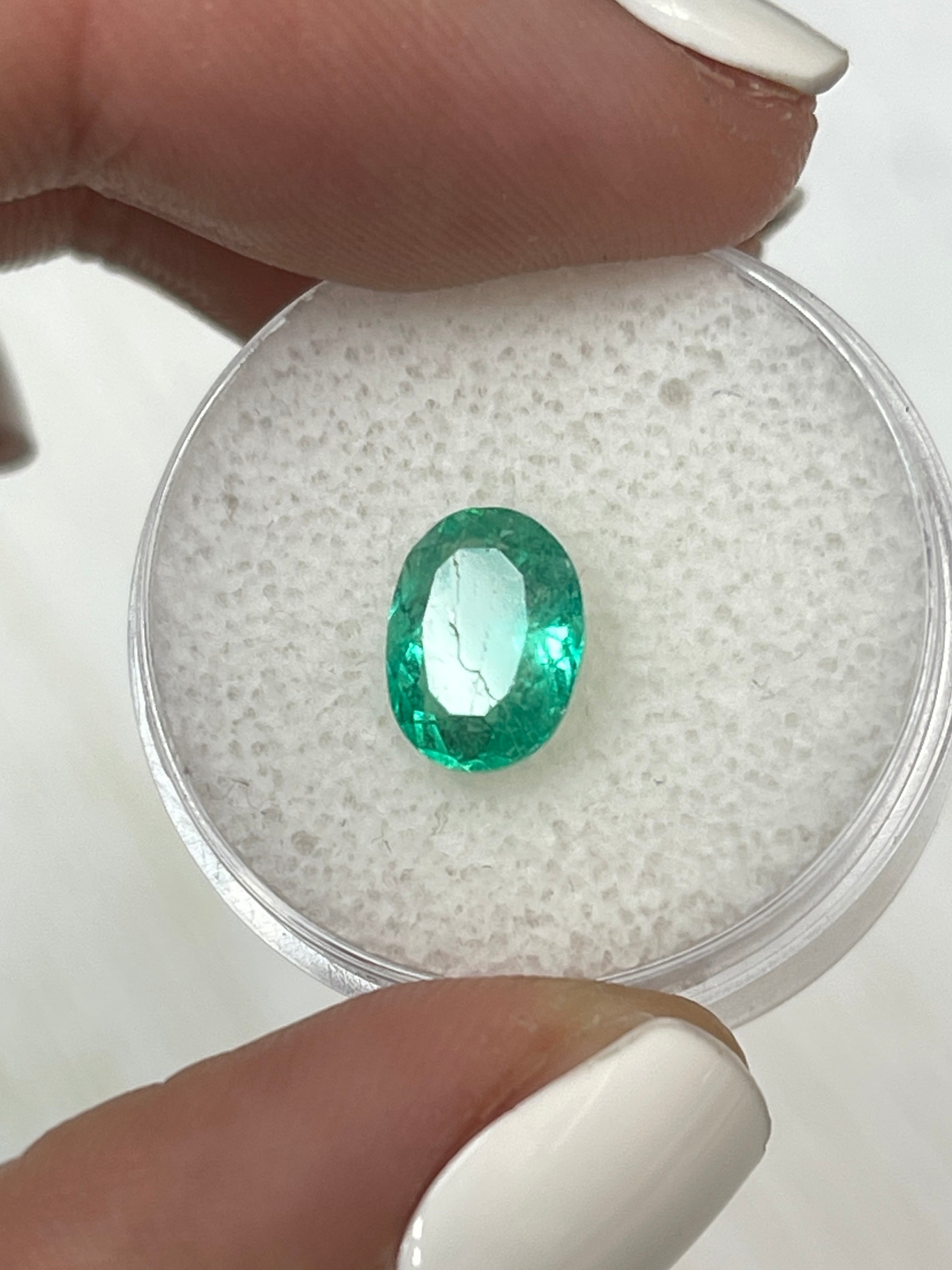 1.86 carat medium light green natural Colombian emerald loose oval cut gemstone from JR Colombian Emeralds.