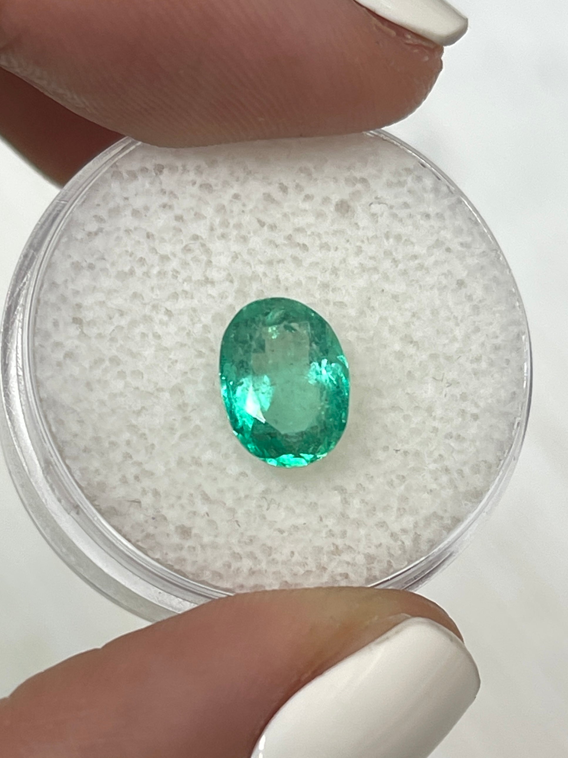 Medium light green 1.86 carat Colombian emerald loose oval cut, natural gemstone by JR Colombian Emeralds.
