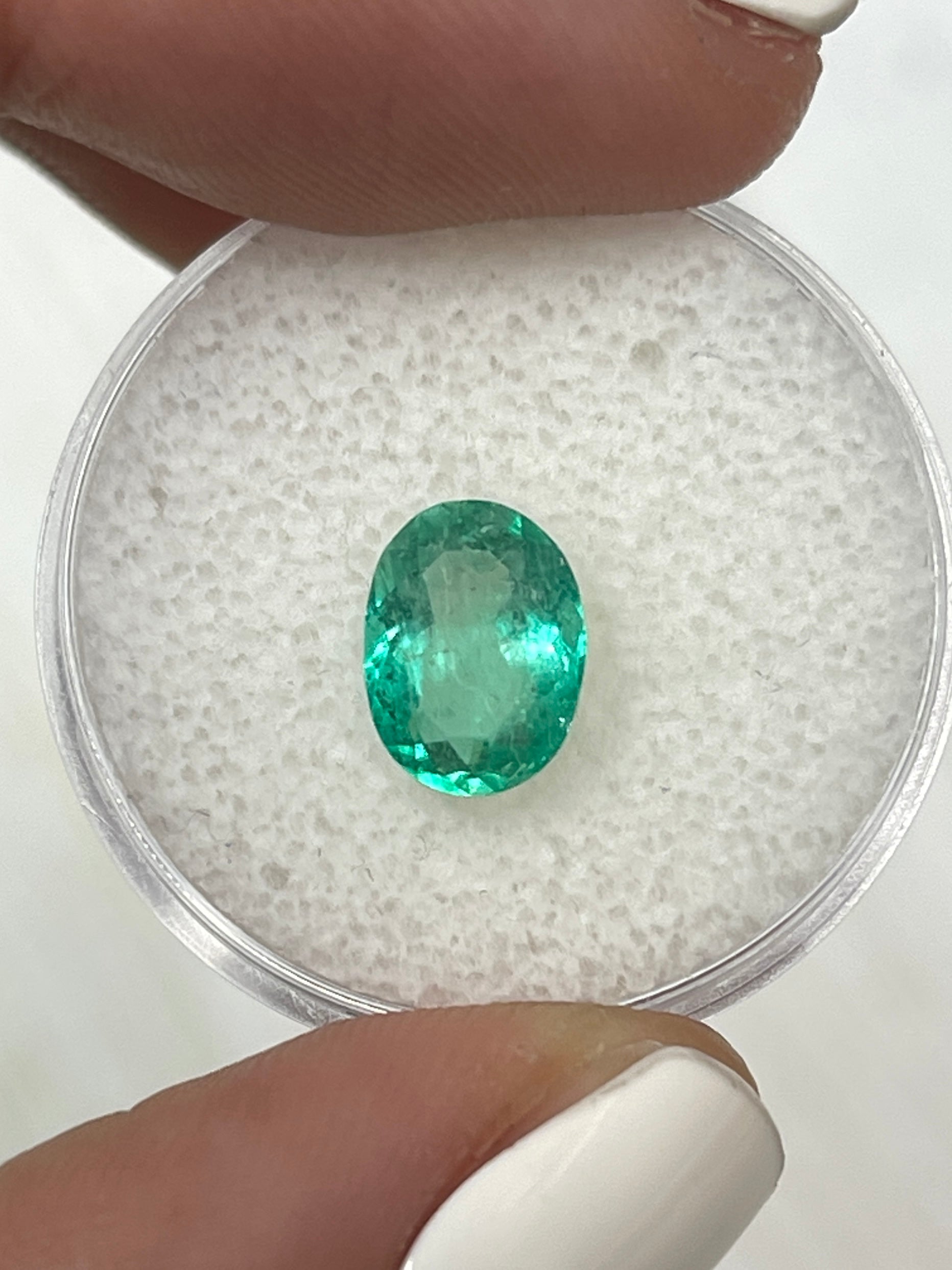 Medium light green 1.86 carat Colombian emerald in oval cut, natural loose gemstone by JR Colombian Emeralds.