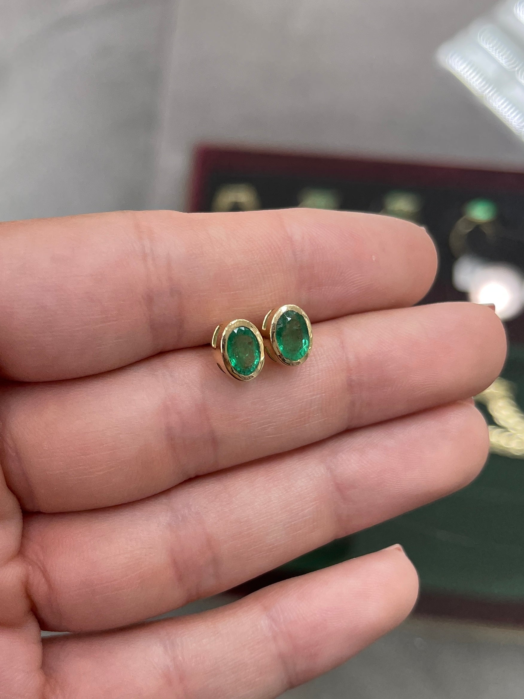 14K gold stud earrings with 1.87ctw natural emeralds in oval cut bezel setting by JR Colombian Emeralds.