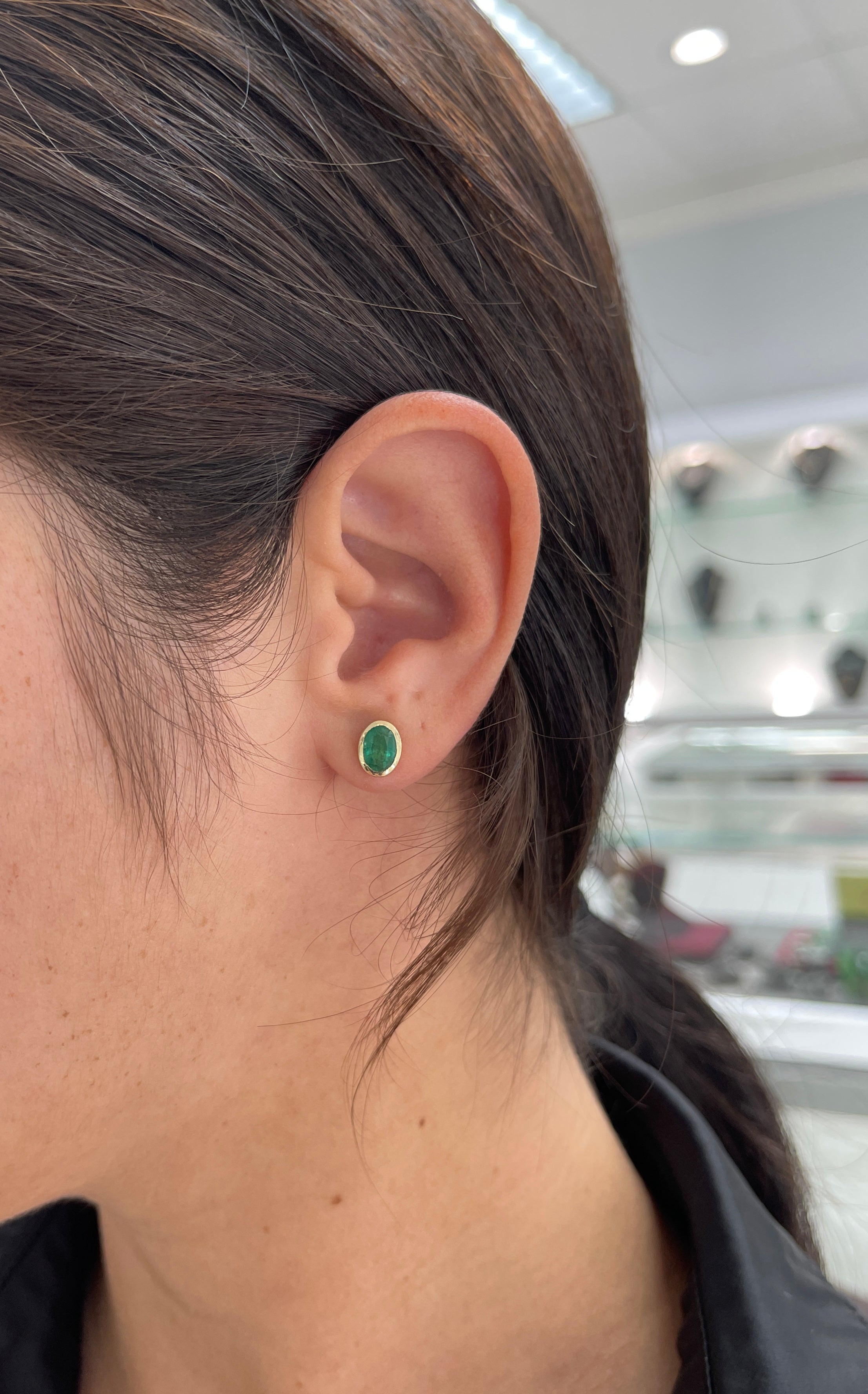 14K gold stud earrings with 1.87 carats of oval cut natural emeralds, bezel set, by JR Colombian Emeralds.