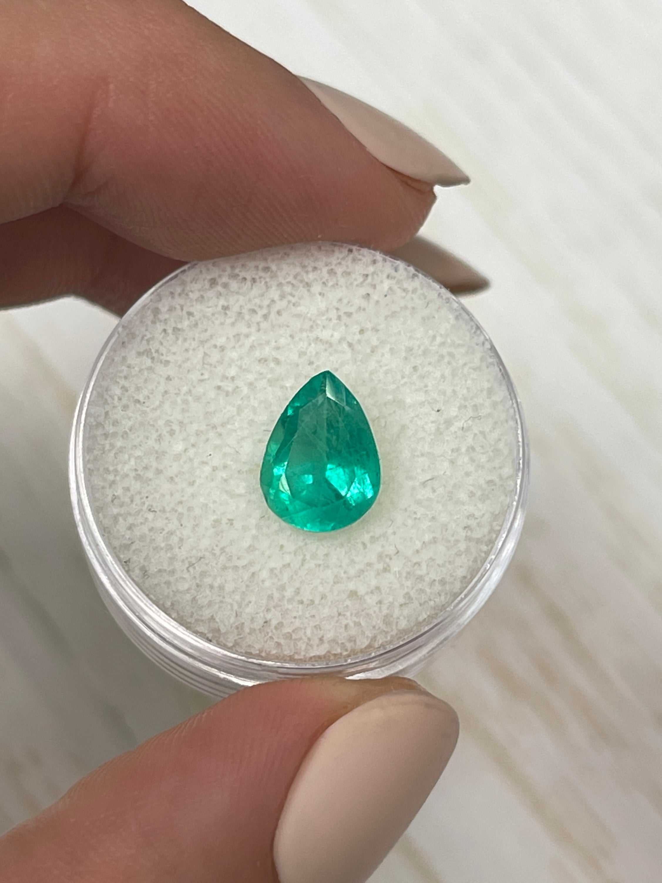 Loose 1.88 Carat Colombian Emerald in a pear cut, vibrant green, natural gemstone from JR Colombian Emeralds.
