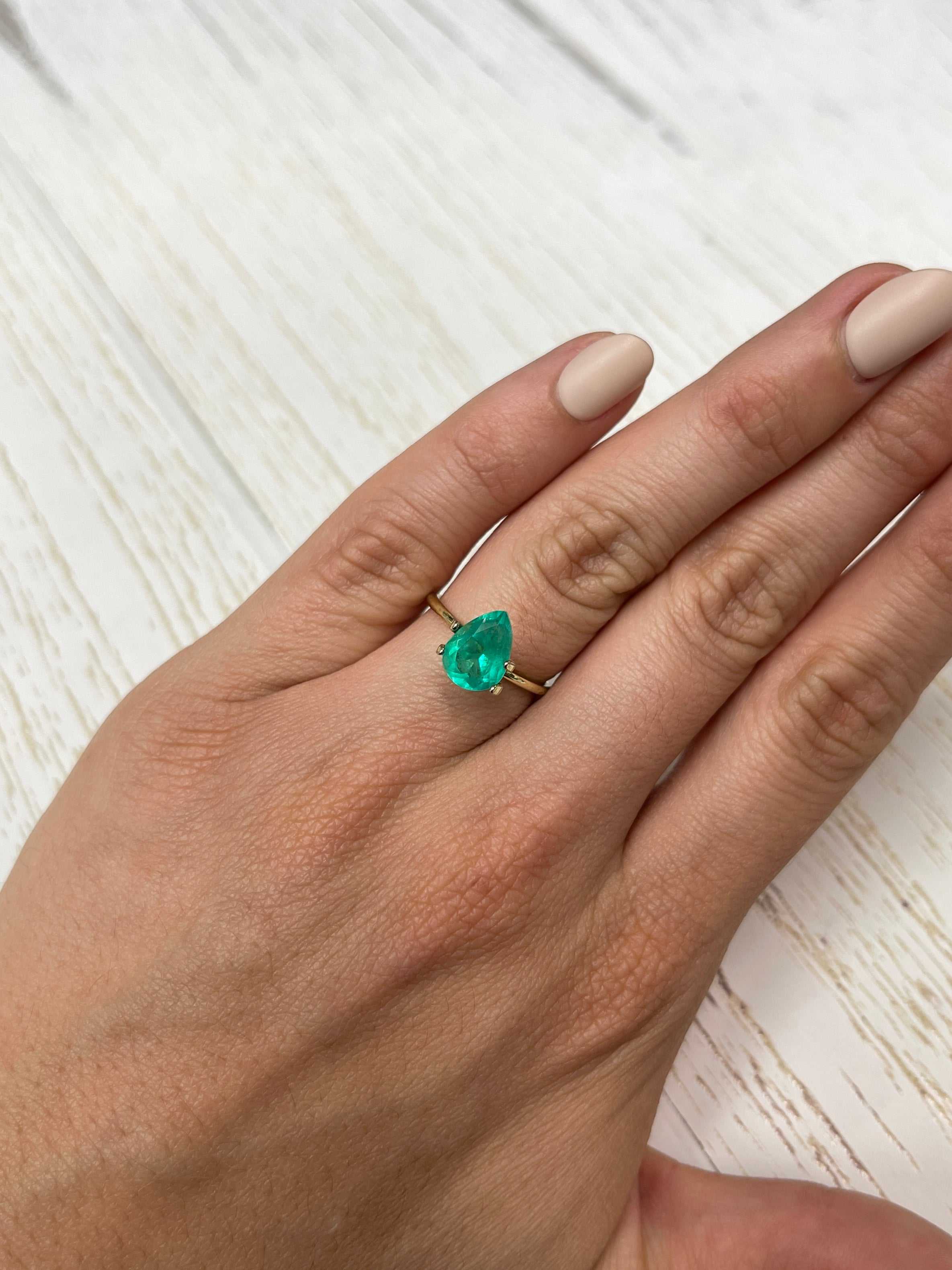 1.88 Carat chunky green natural Colombian emerald loose gemstone with pear cut, from JR Colombian Emeralds, showcasing vibrant color and clarity.