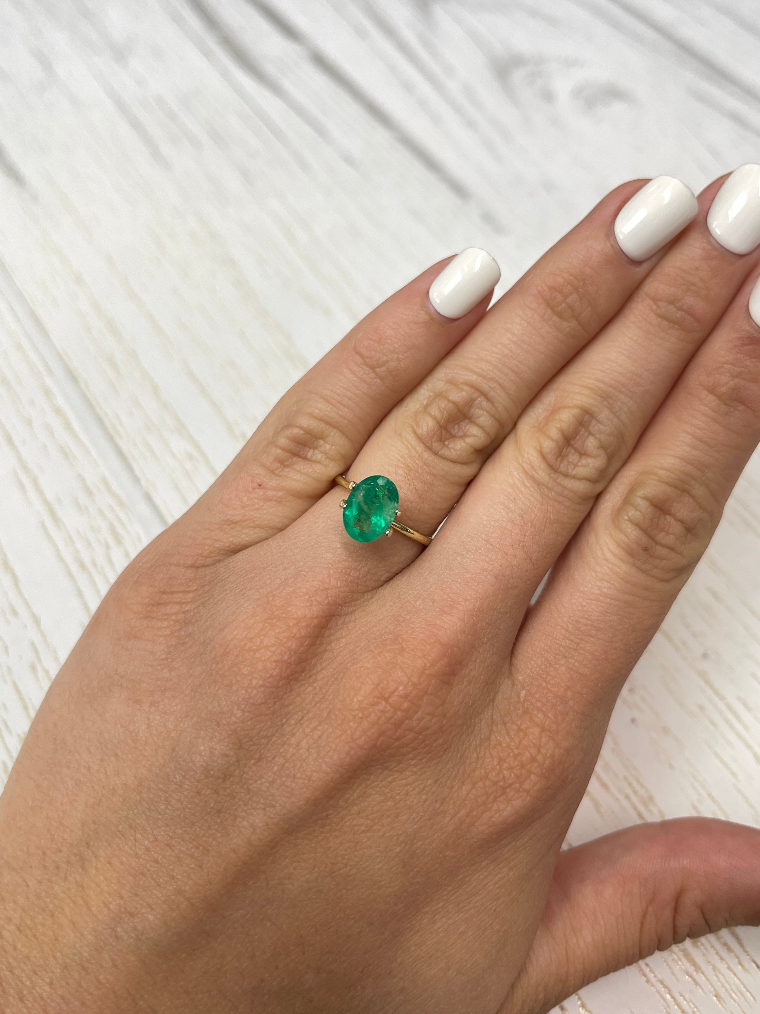 Oval cut 1.94 carat green natural Colombian emerald loose gemstone from JR Colombian Emeralds.