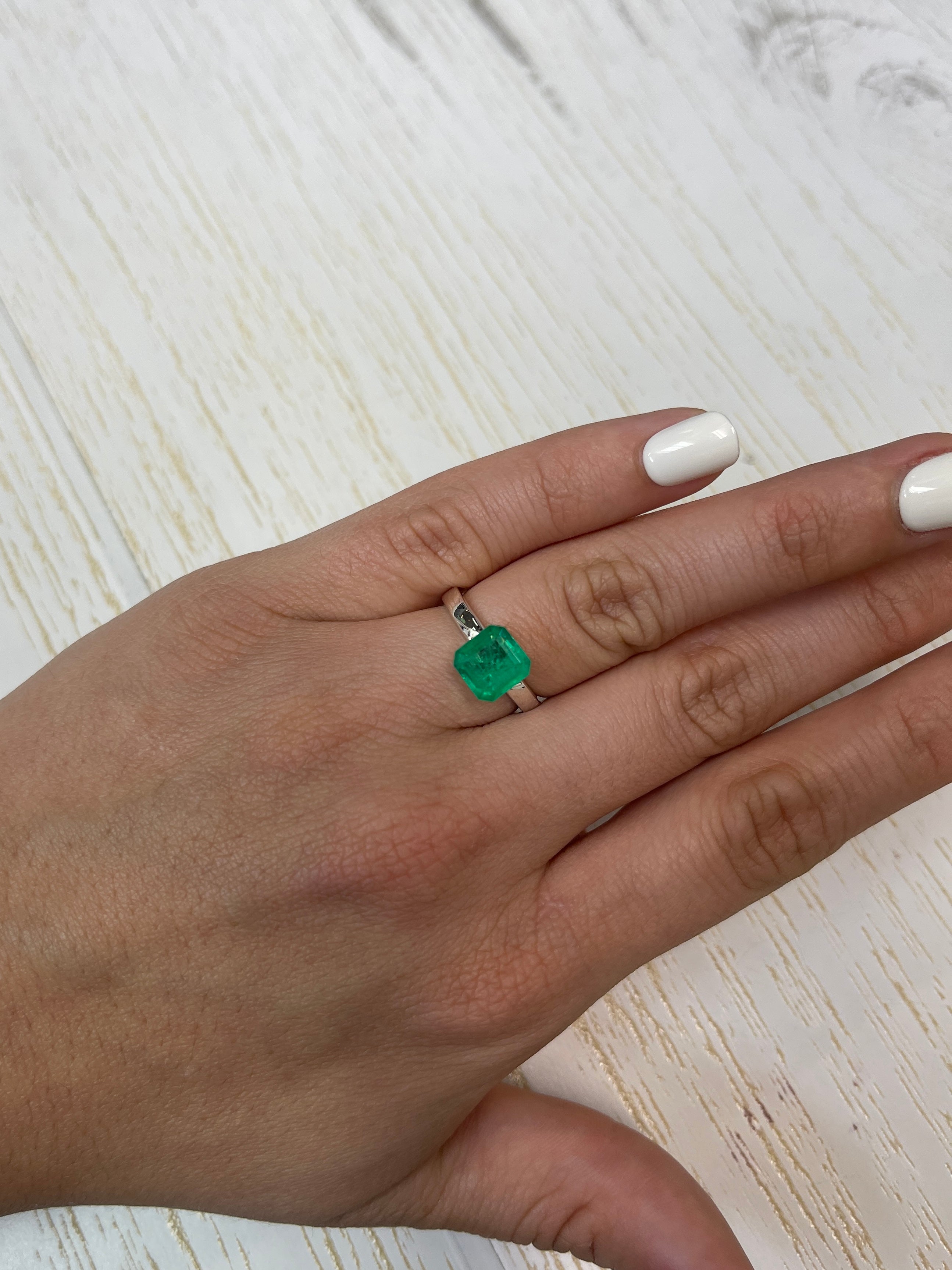 1.97 carat spready Muzo green Colombian emerald loose Asscher cut gemstone from JR Colombian Emeralds.