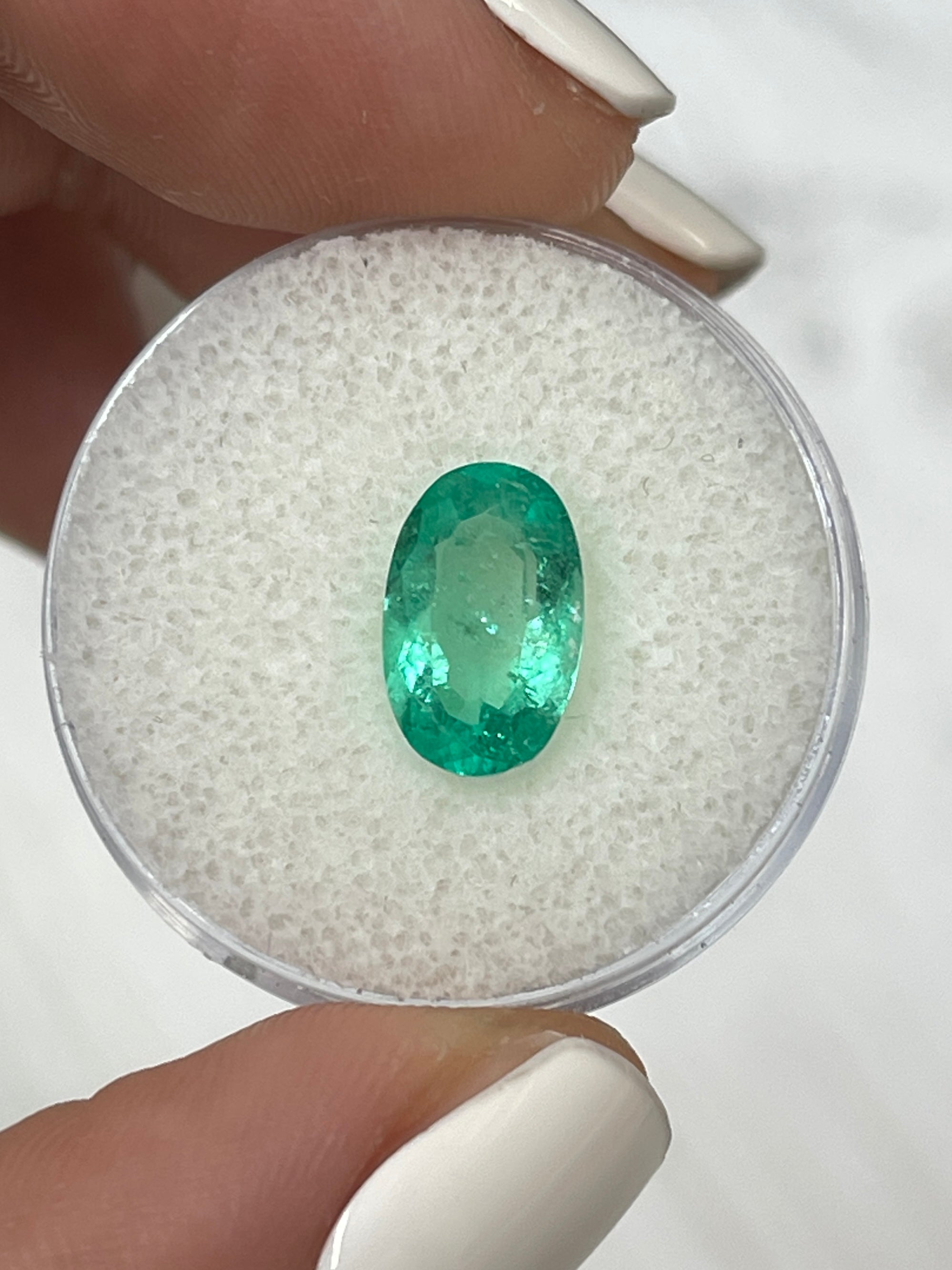 Elongated 11x7mm green natural Colombian emerald loose gemstone, oval cut, 1.98 carats, from JR Colombian Emeralds.