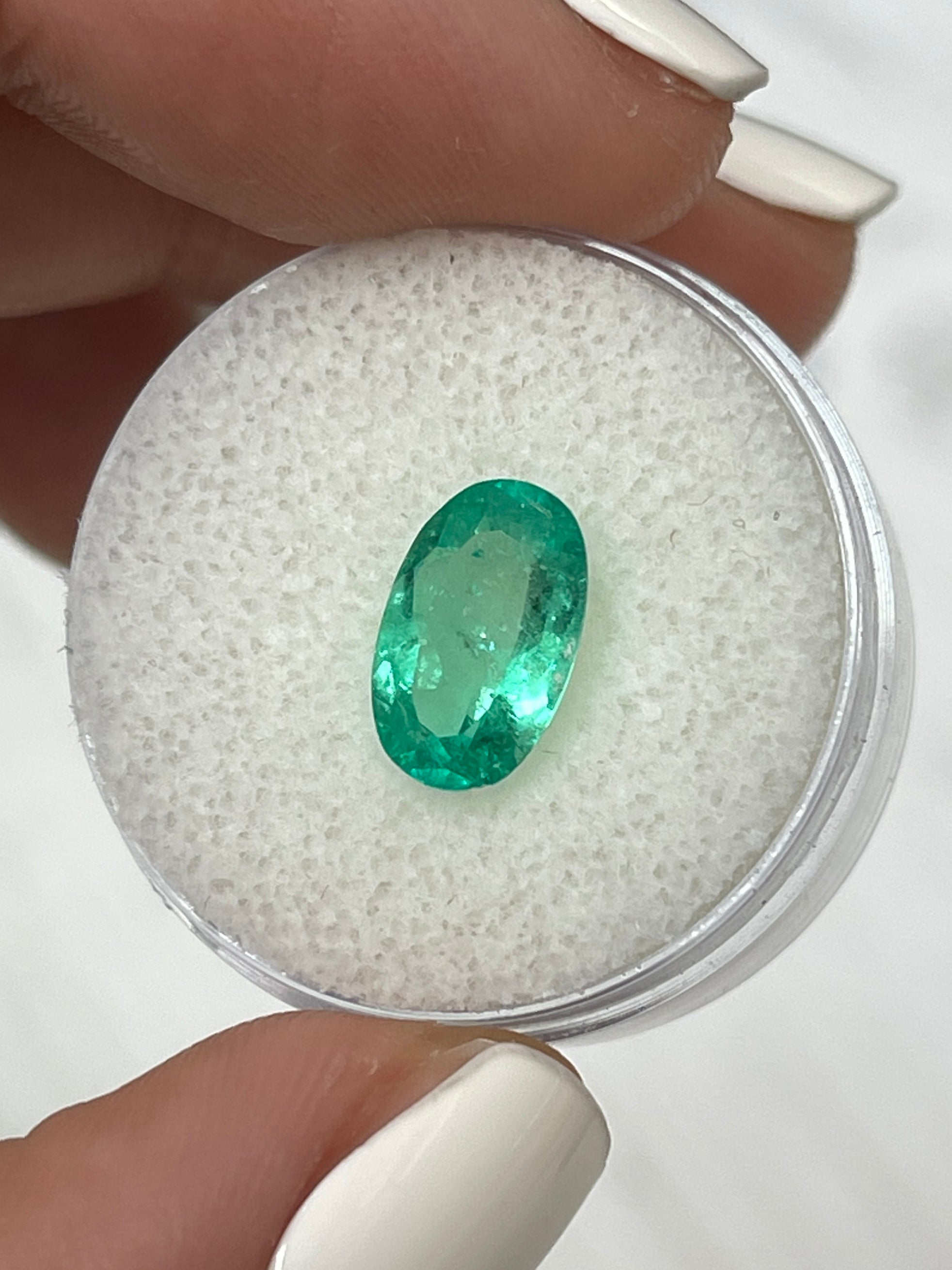 1.98 carat elongated green Colombian emerald loose oval cut gemstone from JR Colombian Emeralds. Natural and vibrant green color.