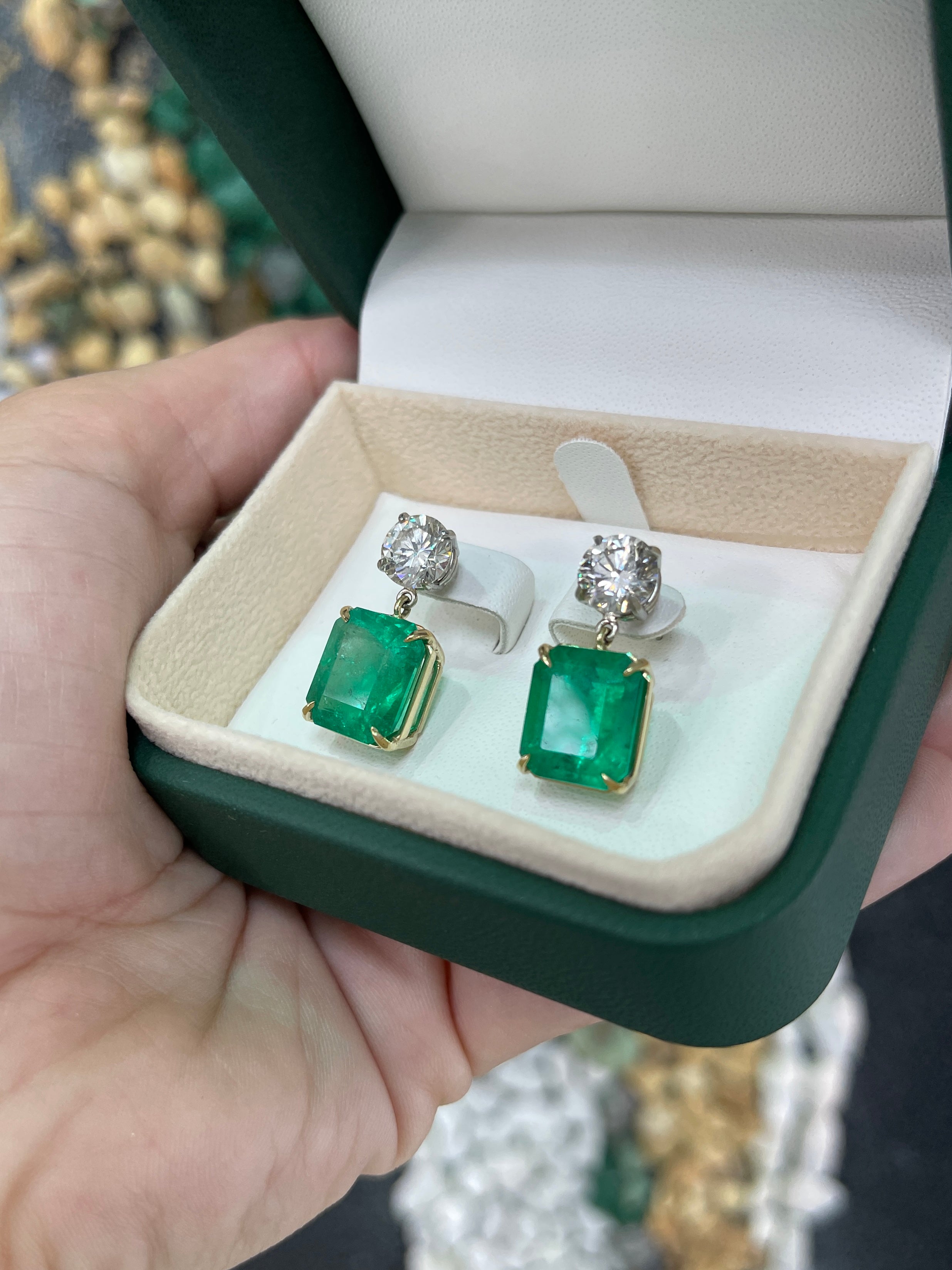 JR Colombian Emeralds 17.72tcw AAA+ emerald and diamond dangle earrings in 18K gold and platinum, showcasing elegant gemstone detailing.