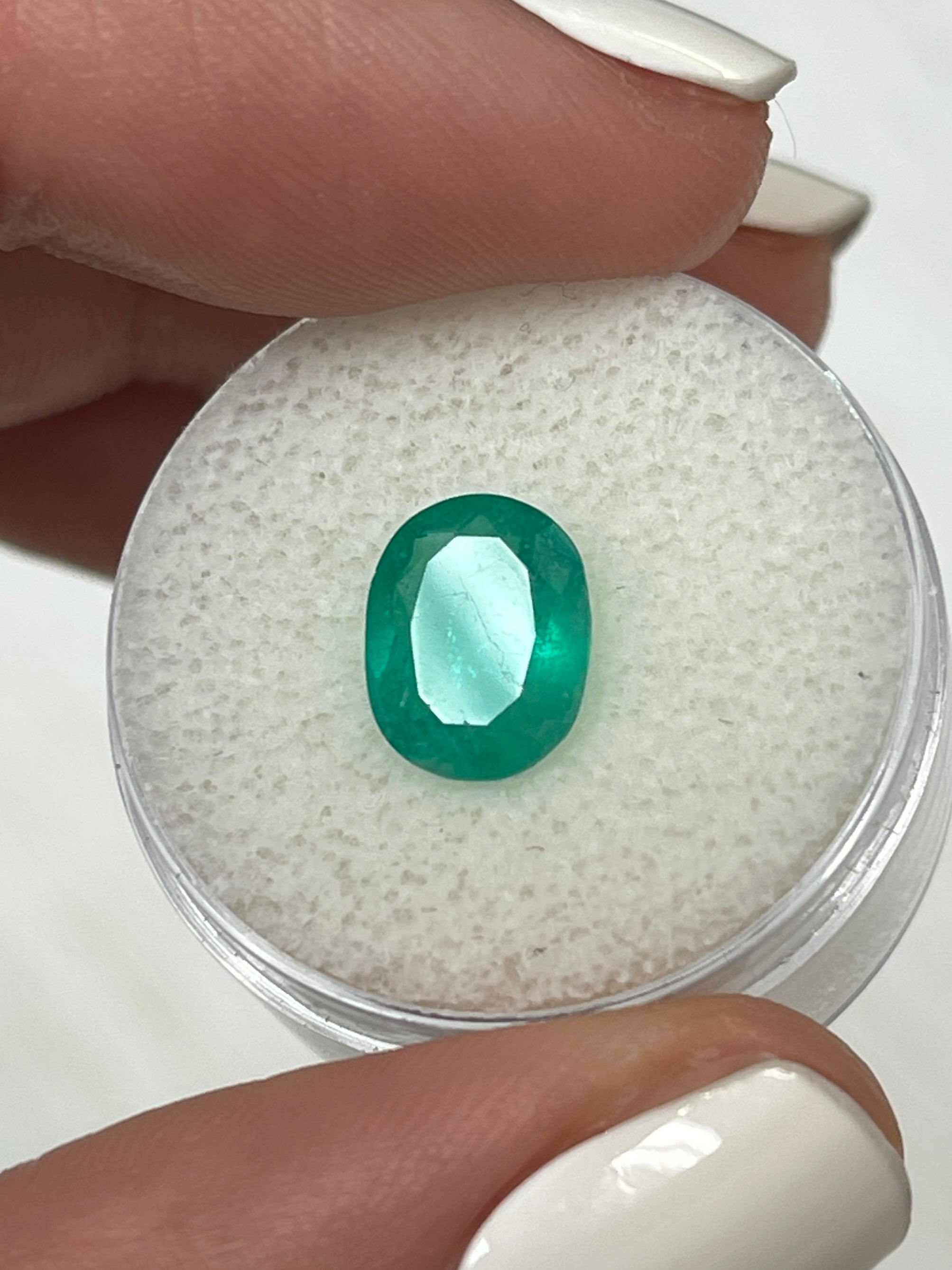 Medium bluish green 2.11 carat Colombian emerald in oval cut, natural loose gemstone by JR Colombian Emeralds.