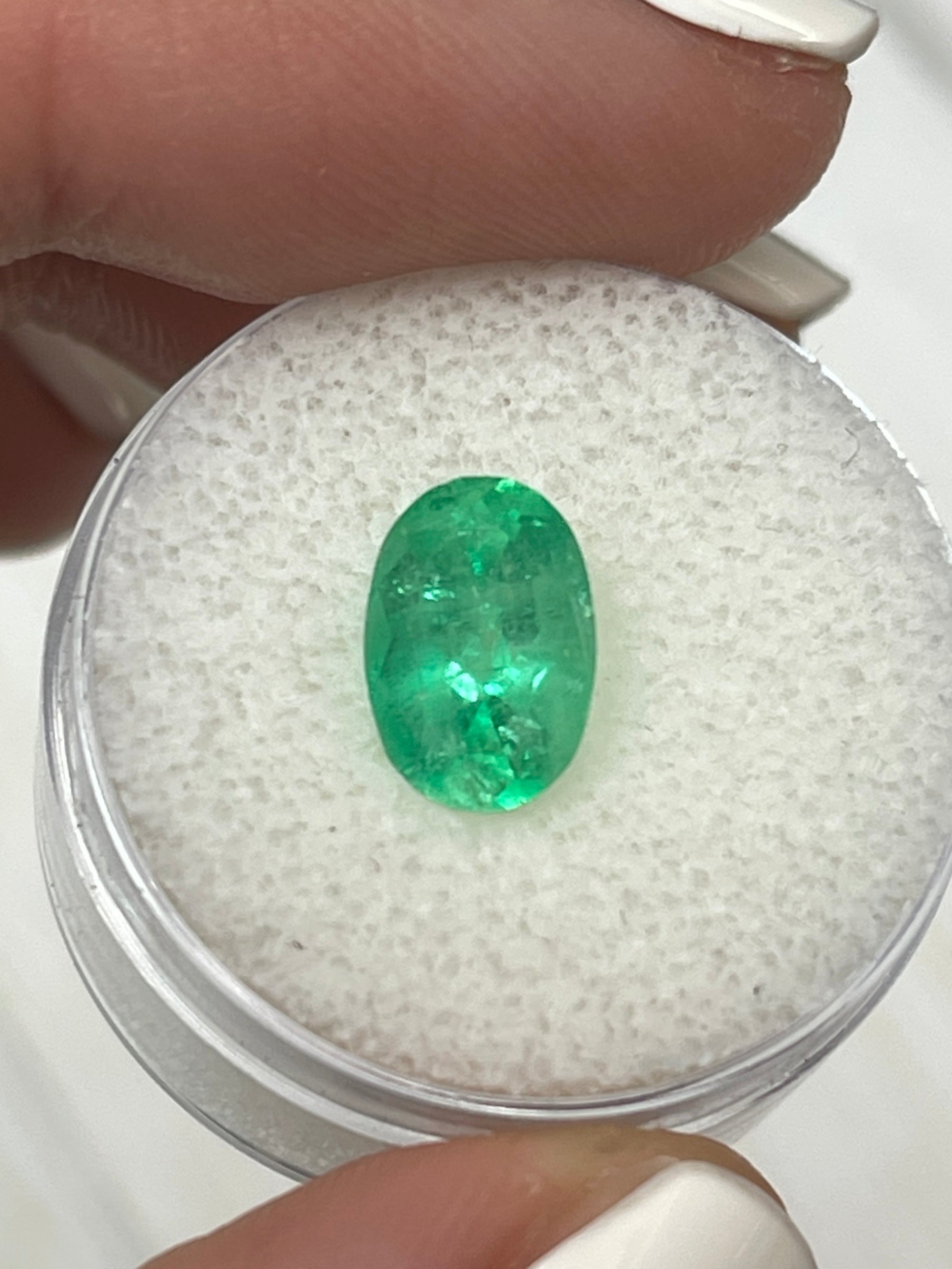 2.18 carat yellowish green natural Colombian emerald in oval cut, loose gemstone from JR Colombian Emeralds.