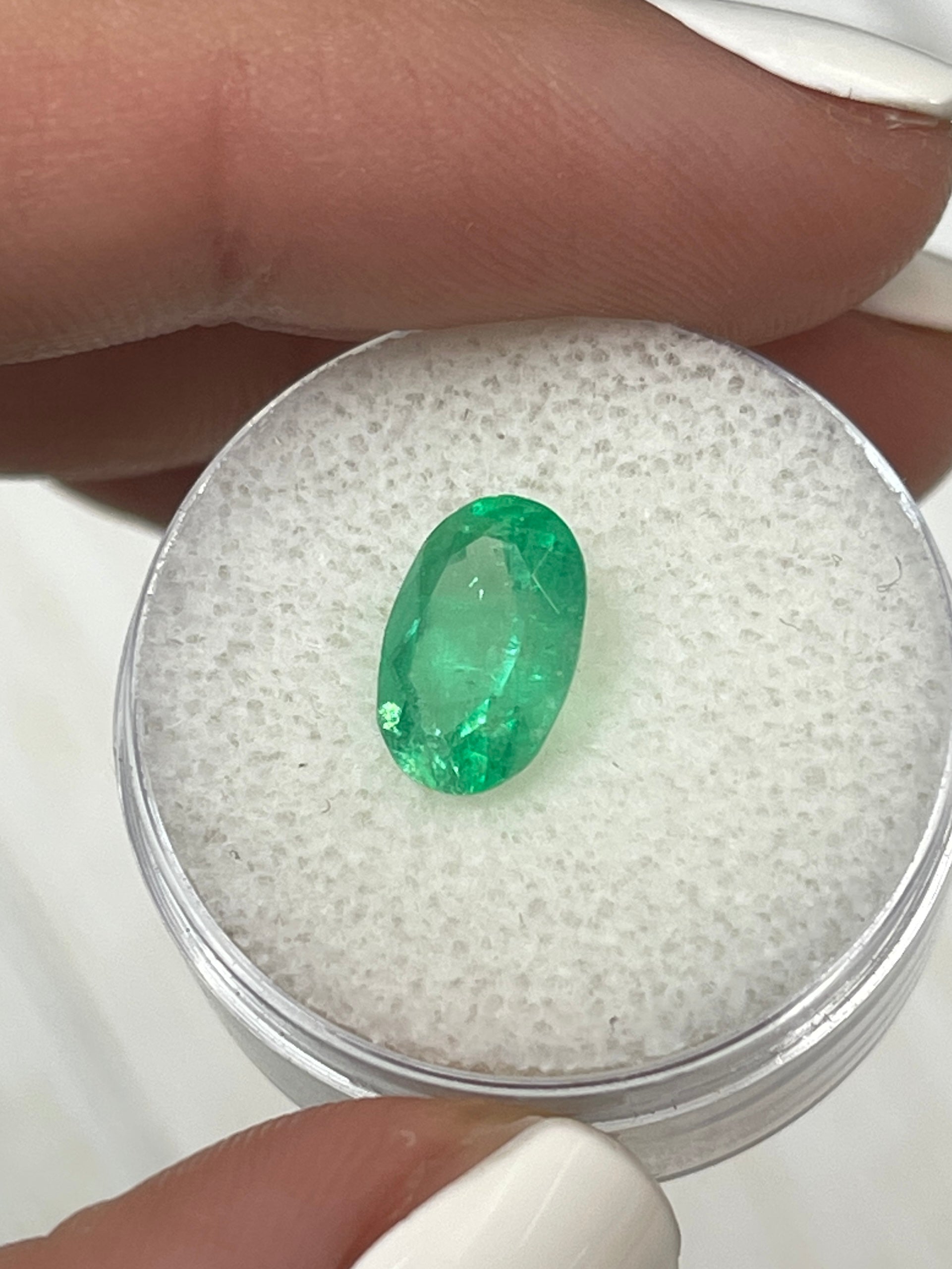 Oval cut yellowish green 2.18 carat natural Colombian emerald loose gemstone from JR Colombian Emeralds.