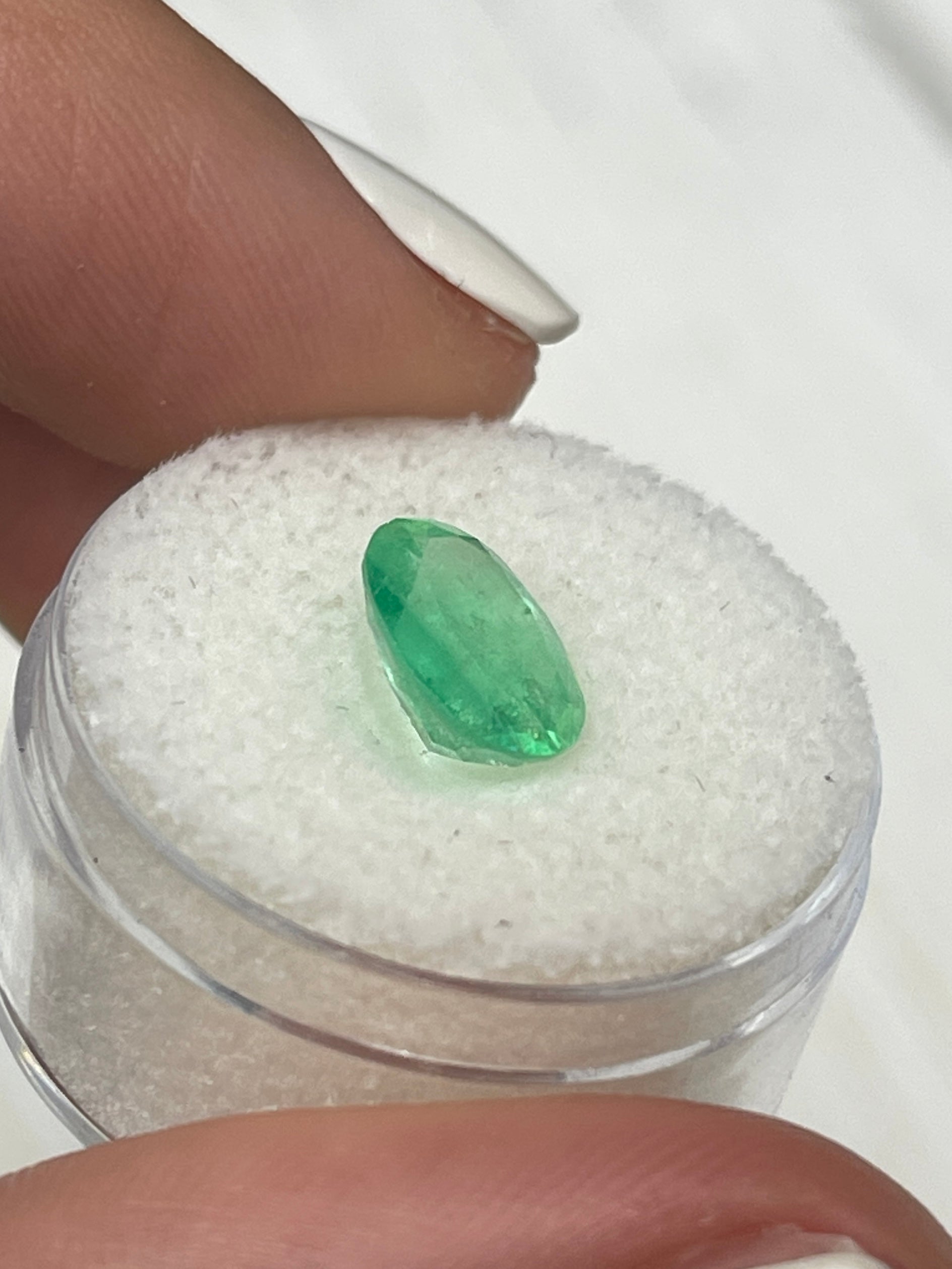 2.18 carat yellowish green natural Colombian emerald loose oval cut gemstone from JR Colombian Emeralds.