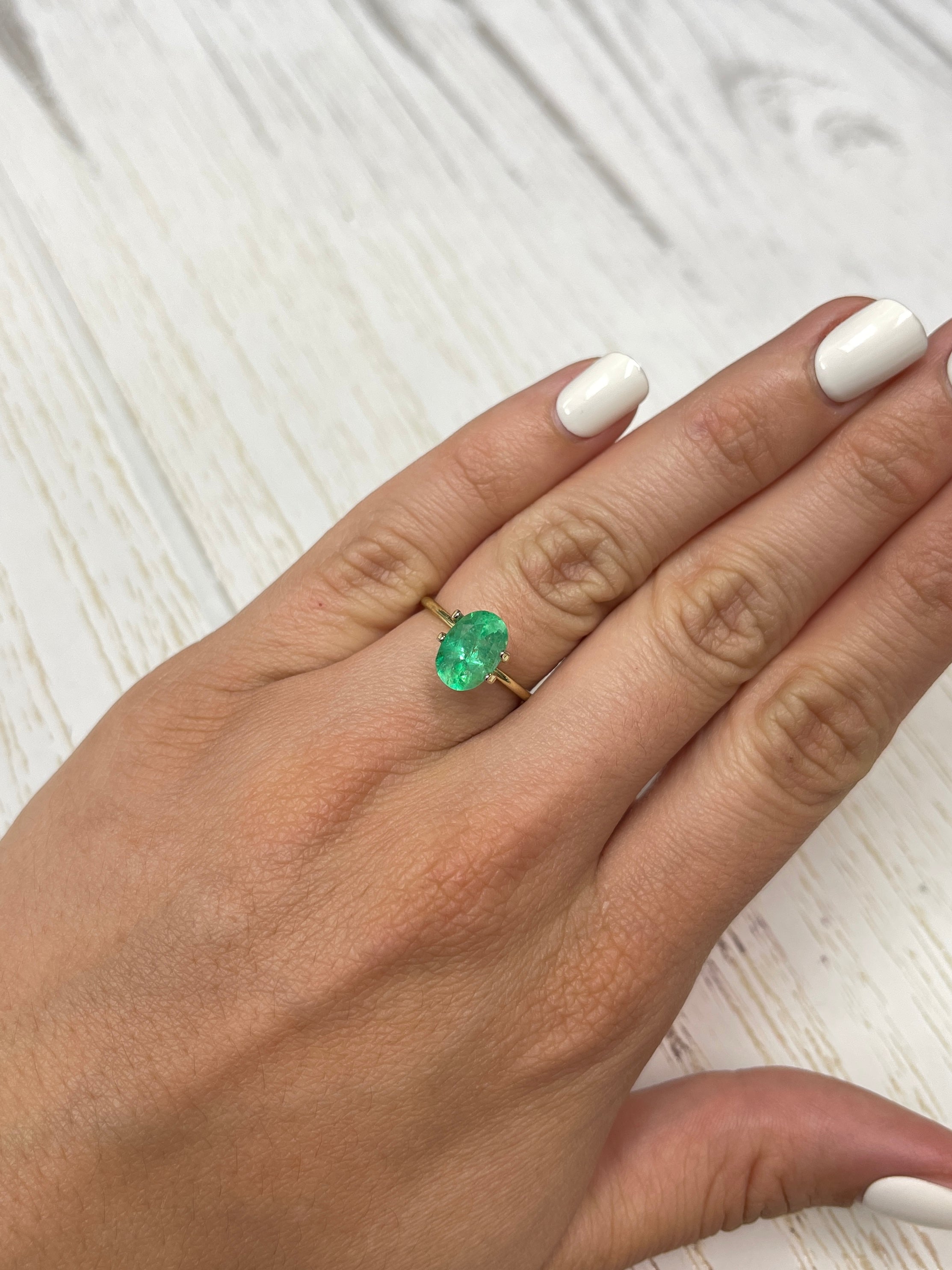 Natural 2.18 carat yellowish green Colombian emerald in oval cut, loose gemstone from JR Colombian Emeralds.
