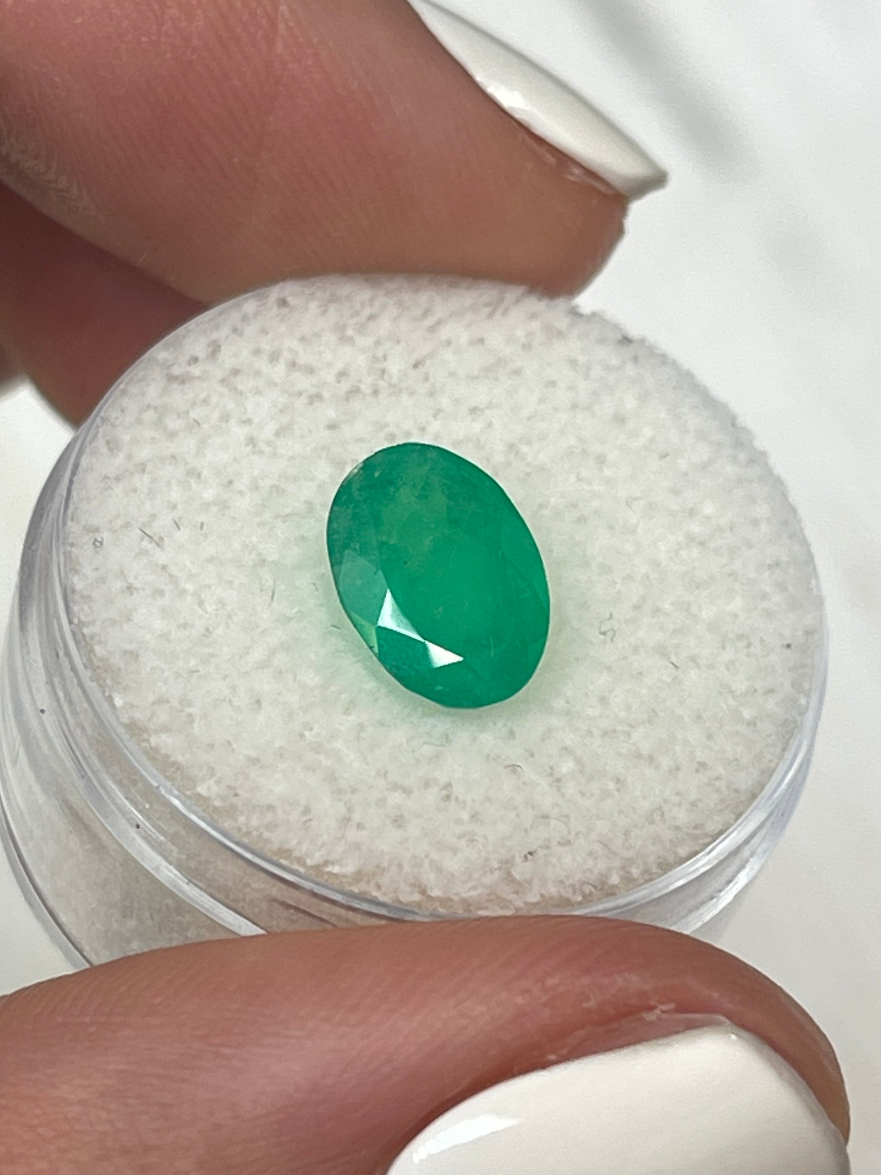 Medium forest green 2.33 carat oval cut Colombian emerald, natural loose gemstone by JR Colombian Emeralds.