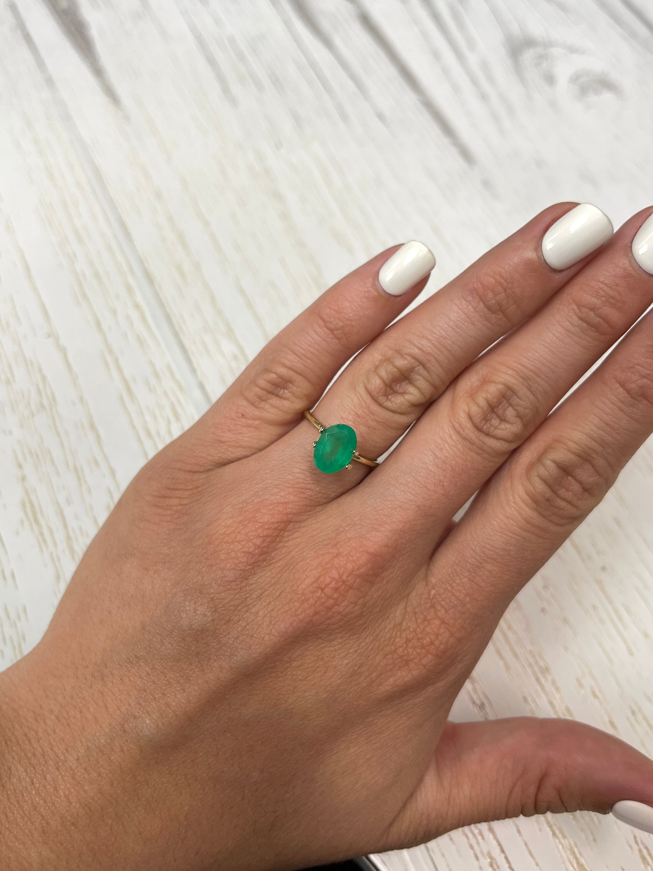 Medium forest green 2.33 carat Colombian emerald loose oval cut from JR Colombian Emeralds, showcasing natural beauty and vibrant color.